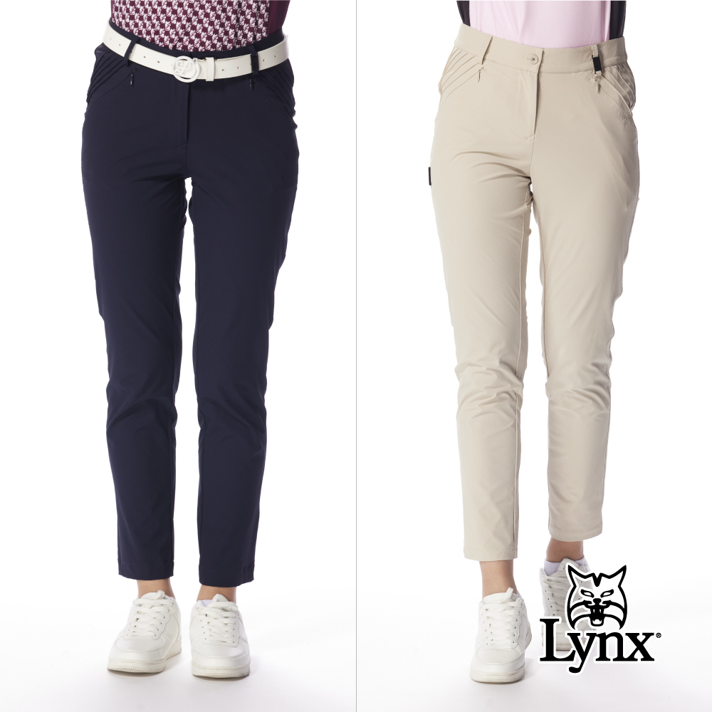 【Lynx Golf】女款修身俐落九分窄筒壓摺設計褲耳飾片時尚設計長褲