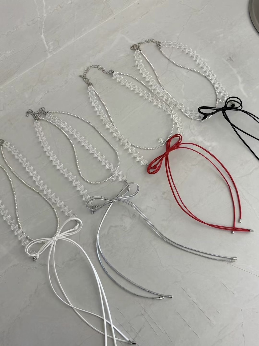 wax cord bow with translucent beads necklace