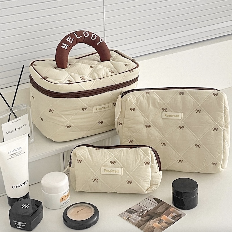 《09184》咖啡色邊邊小蝴蝶結化妝包們