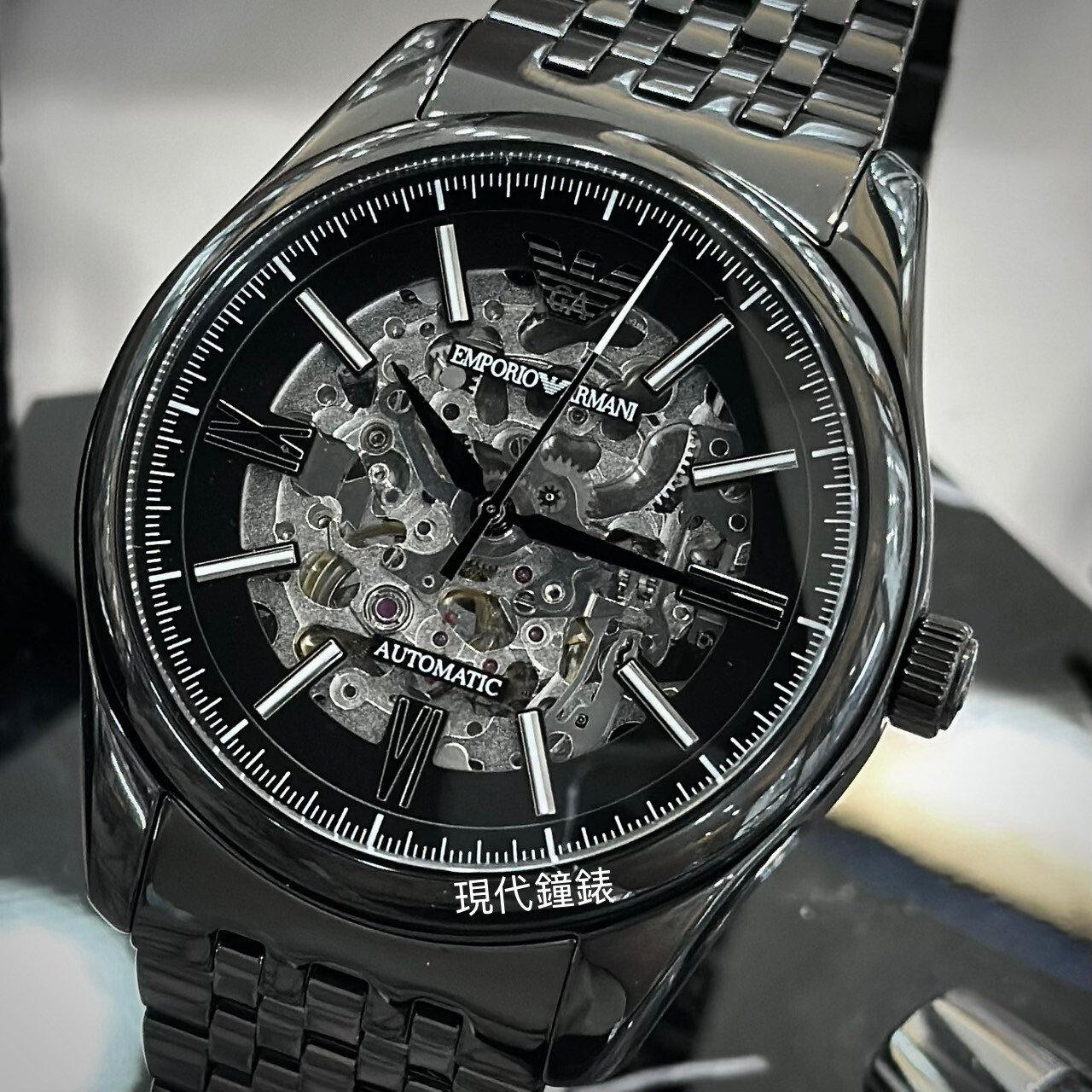 【EMPORIO ARMANI 亞曼尼】時尚黑色鏤空錶盤機械錶AR60093 43mm 現代鐘錶