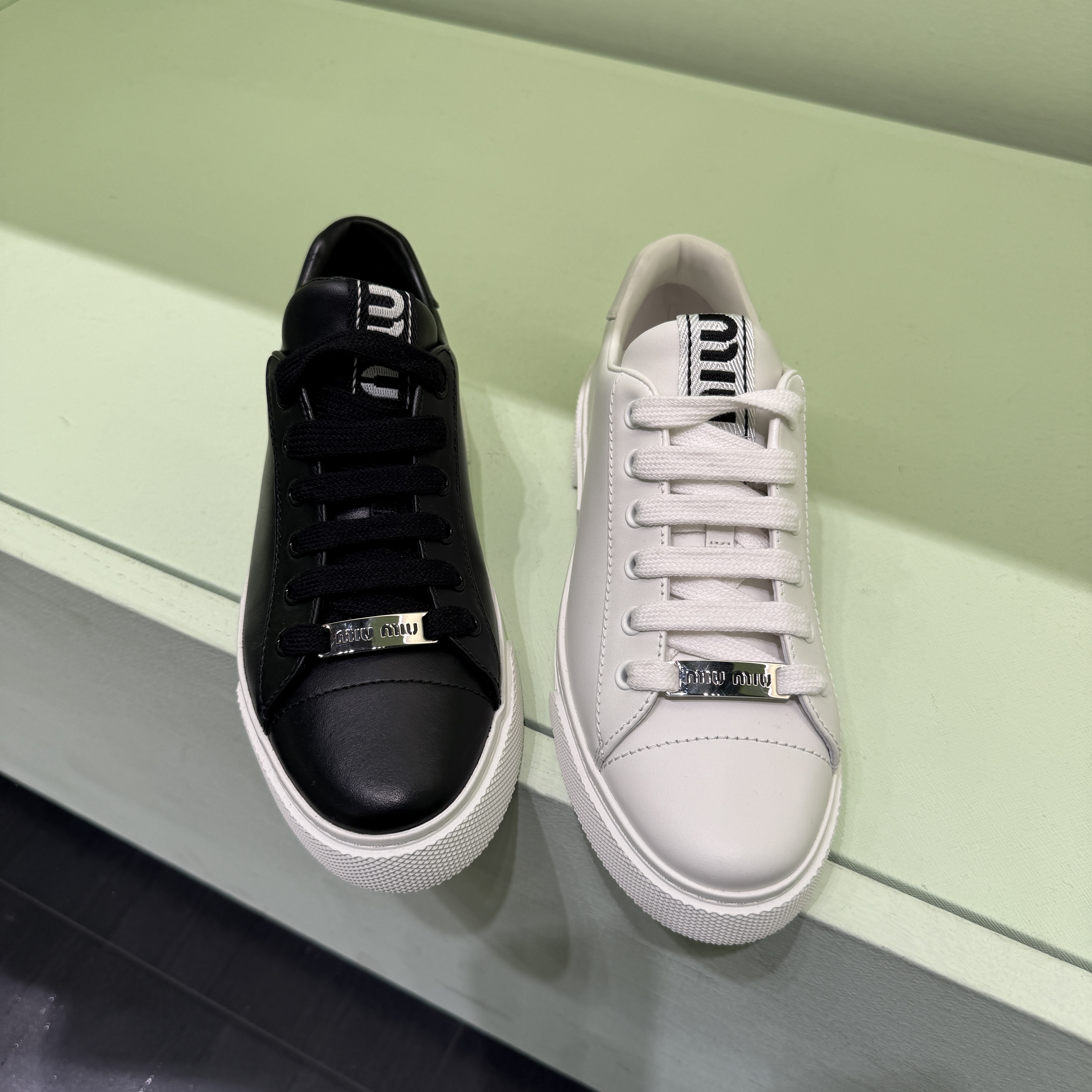 Miumiu Metal logo lace up leather sneakers black white 5E165D