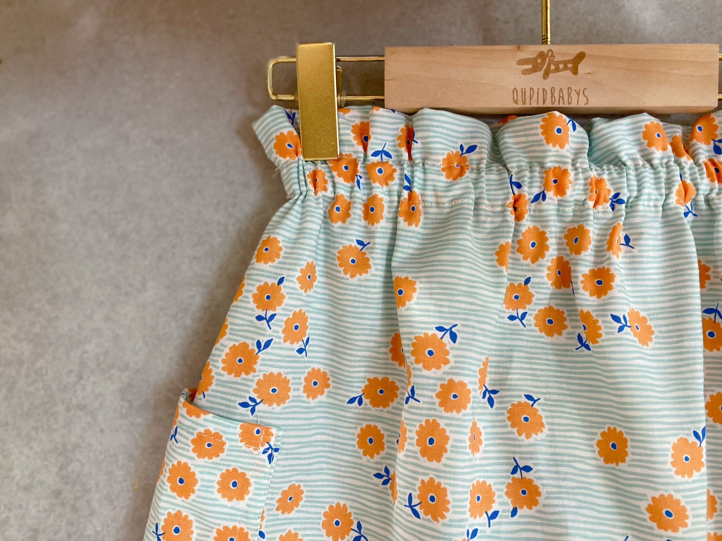 淺綠線條橙花 波浪長褲（100）