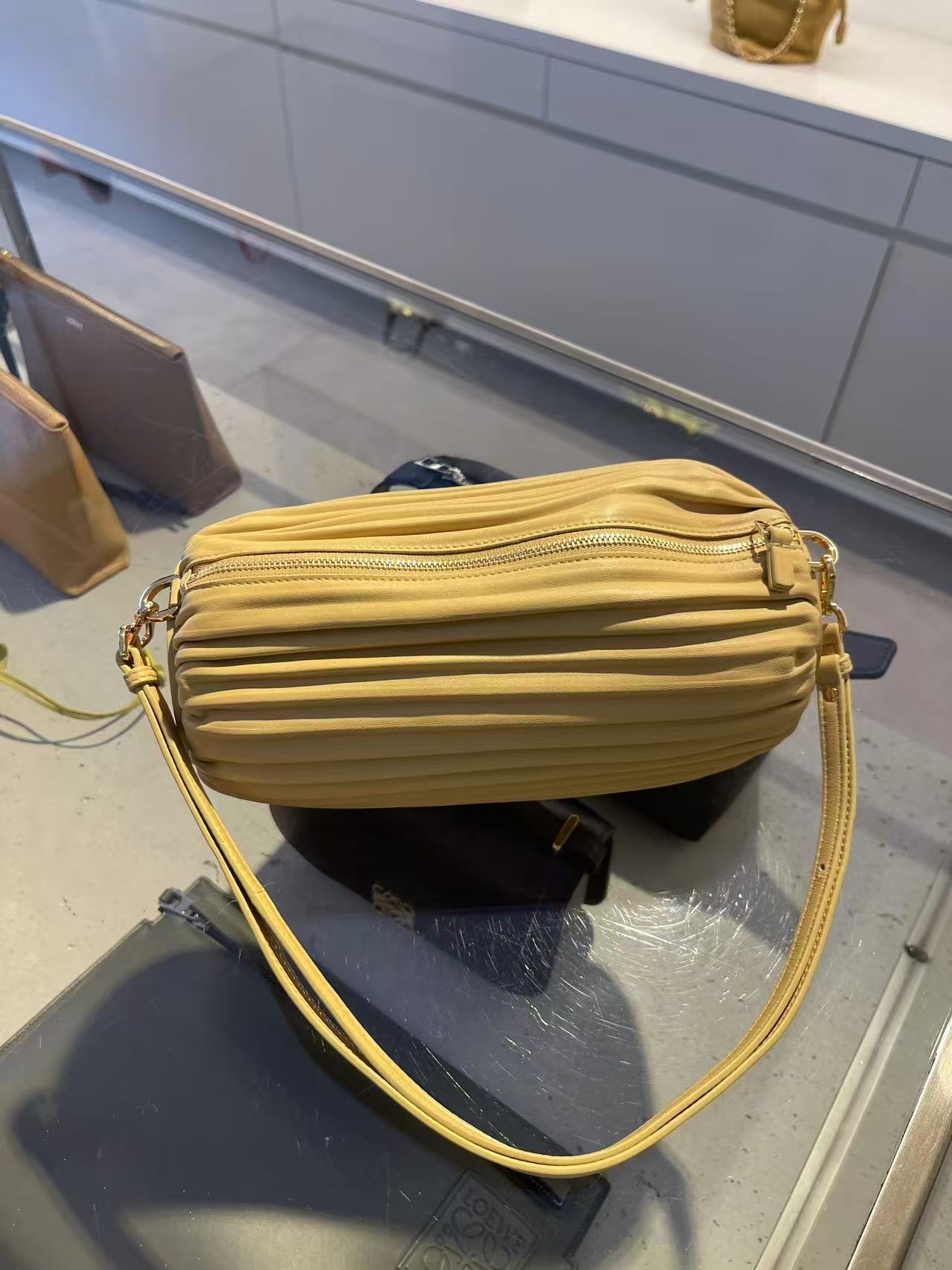 Loewe Bracelet pouch bag Dark butter yellow