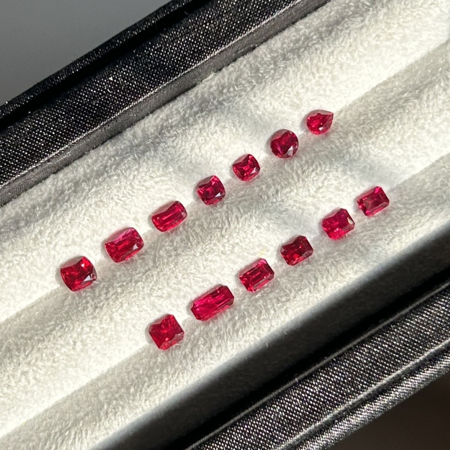 A set of 0.2 to 0.4 carat unheated Mozambique pigeon blood rubies with strong fluorescence.