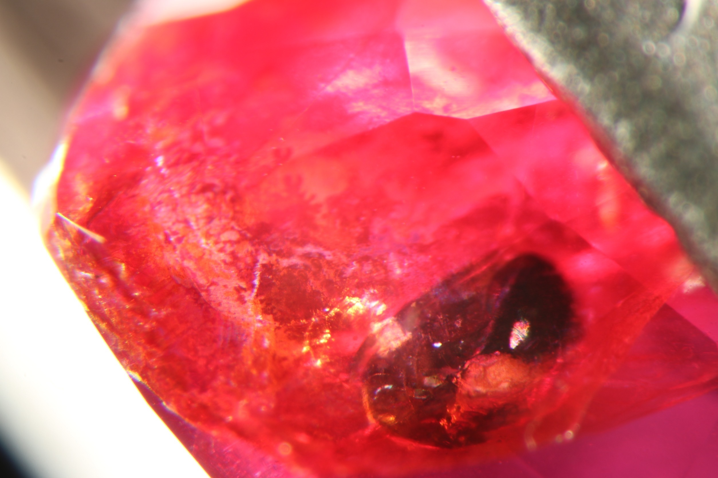 An orangy red fracture in a ruby.