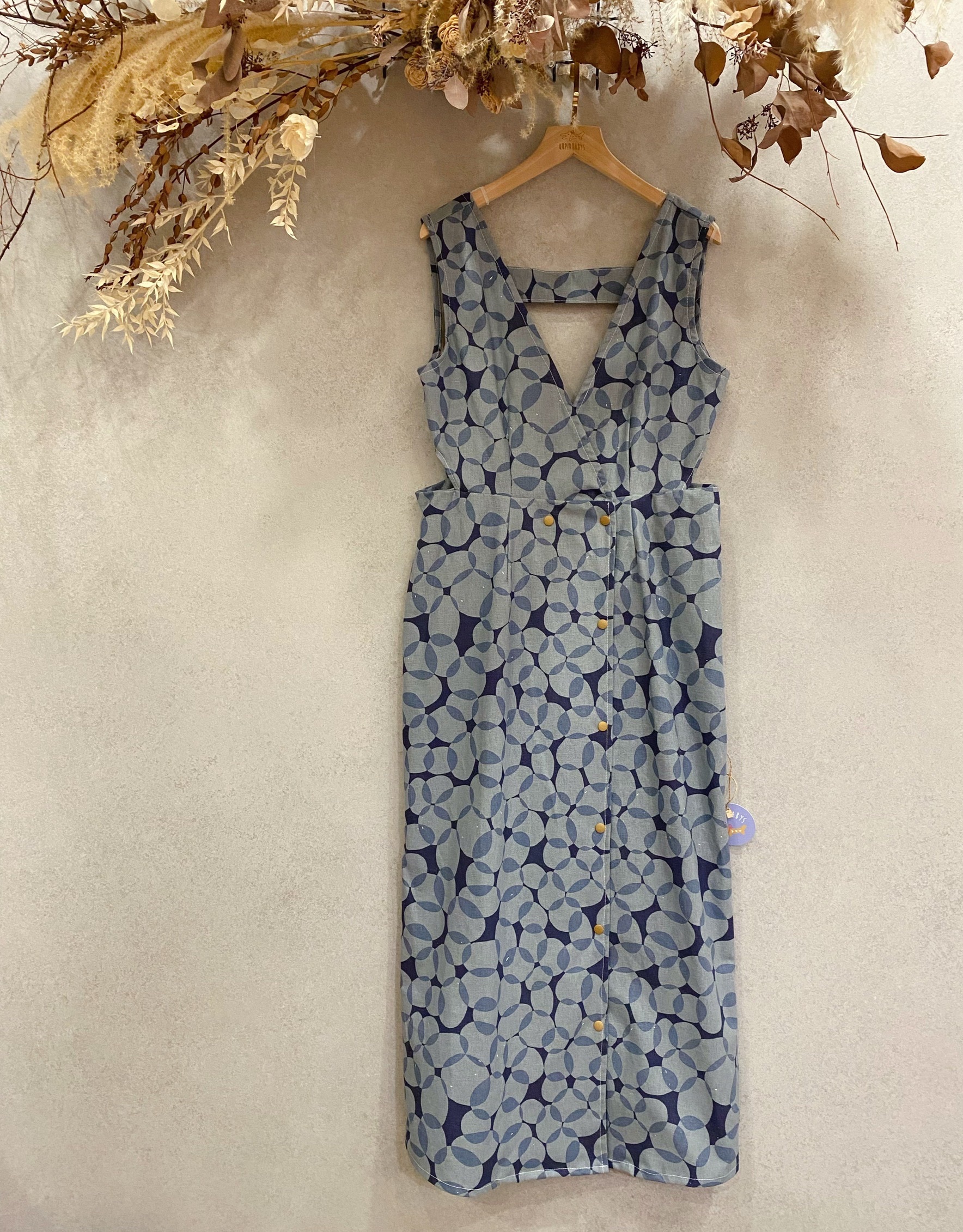 鵝卵石 媽咪側鏤空排釦長洋裝