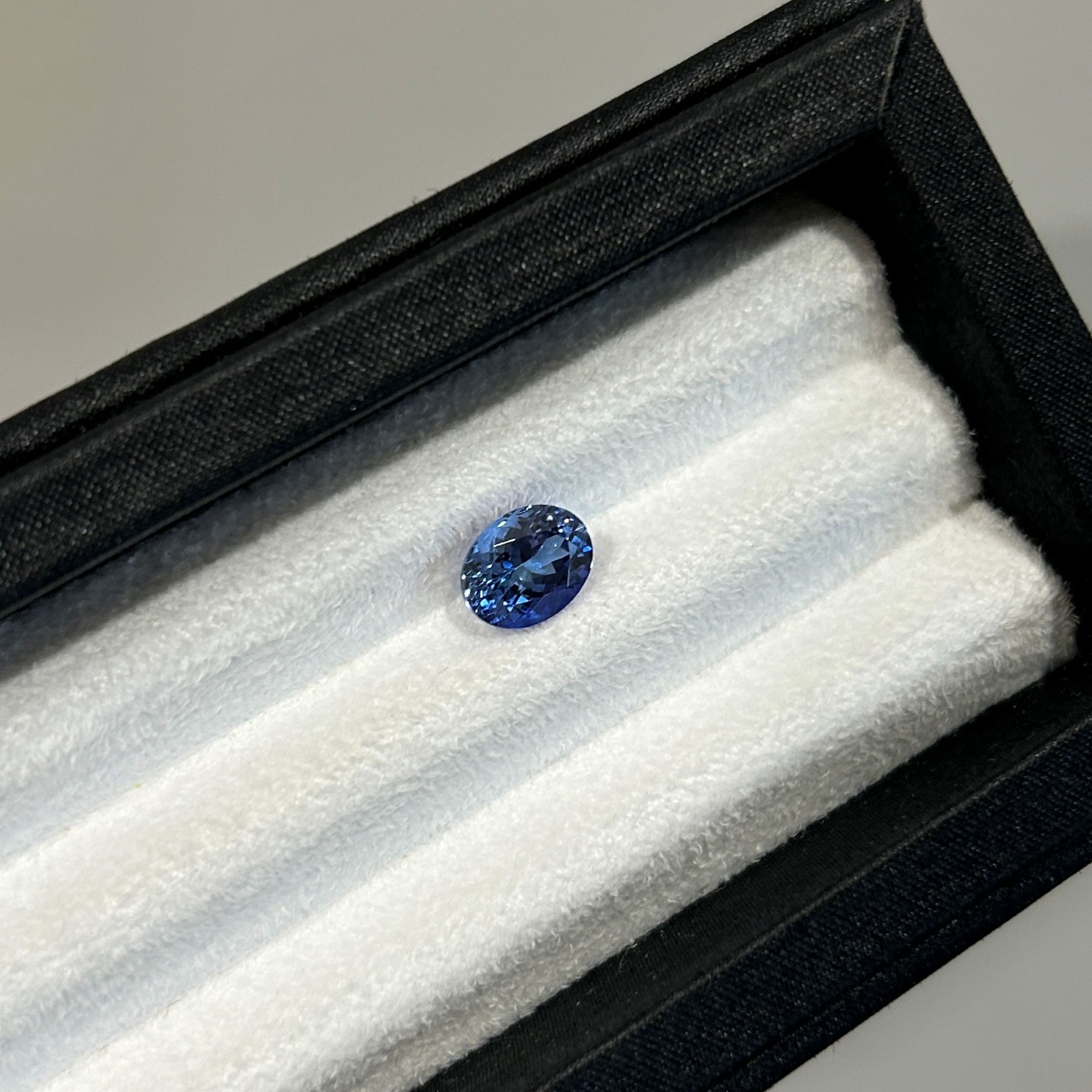 A 2.30 carat oval mixed-cut blue tanzanite.