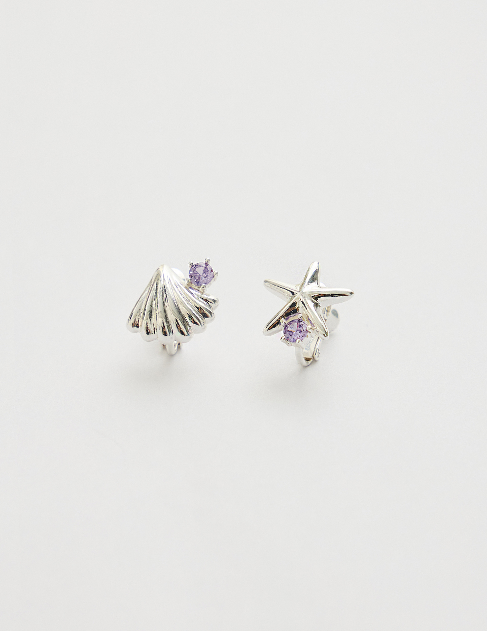 不對稱海星貝殼。夾式耳環