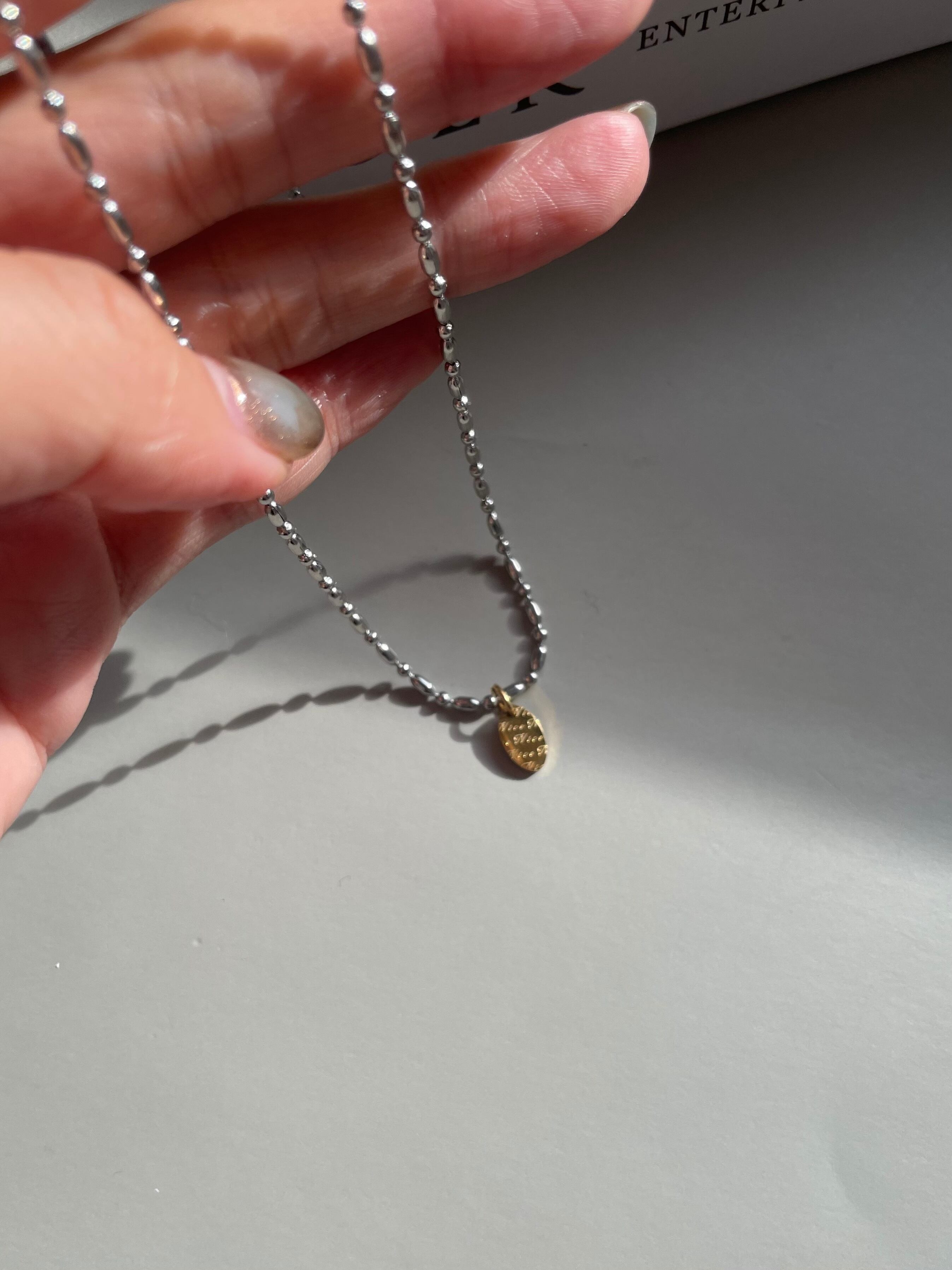 gold oval charm necklace