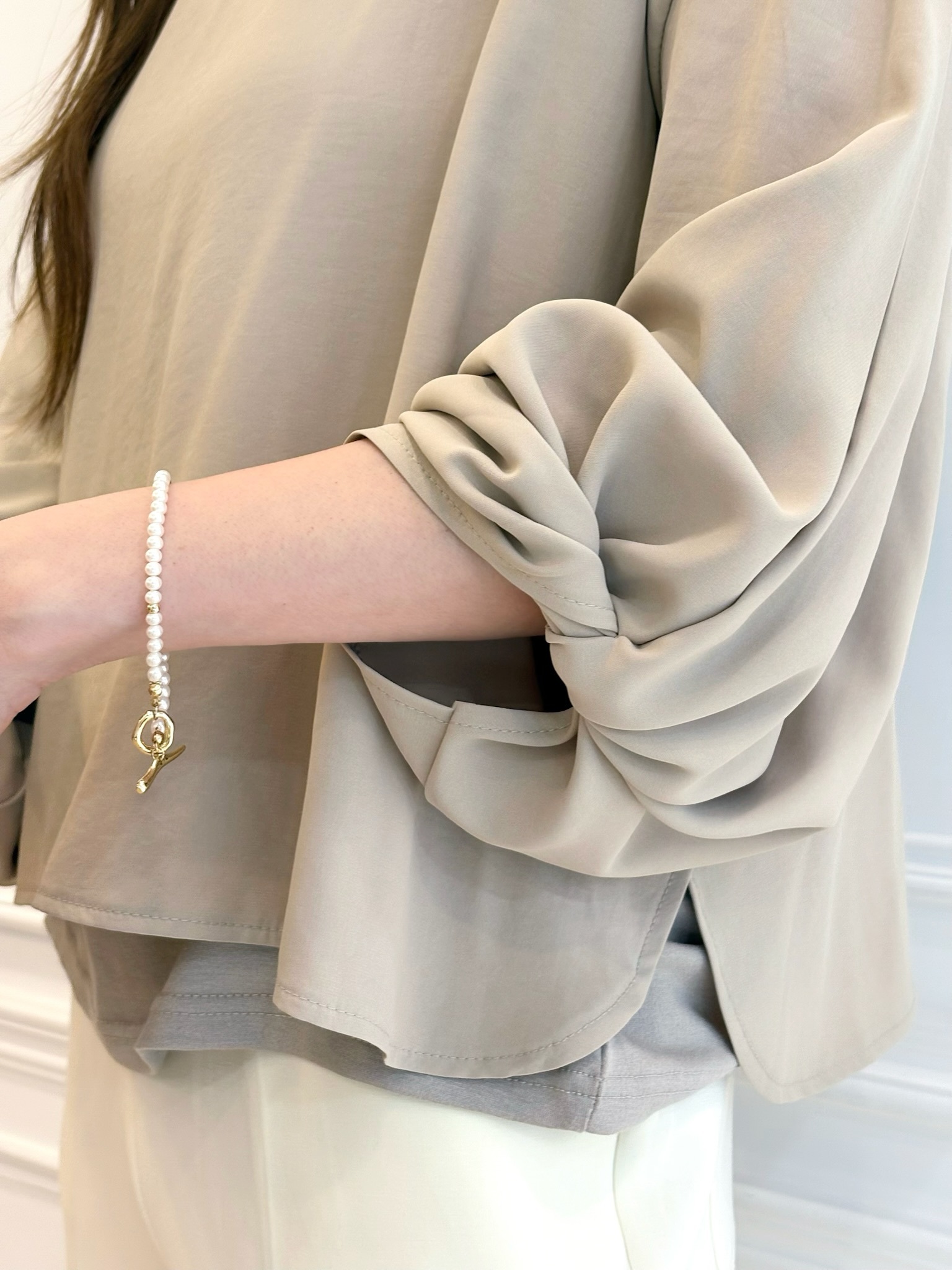 扭結澎袖雙層面料上衣