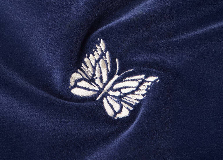 needles butterfly logo