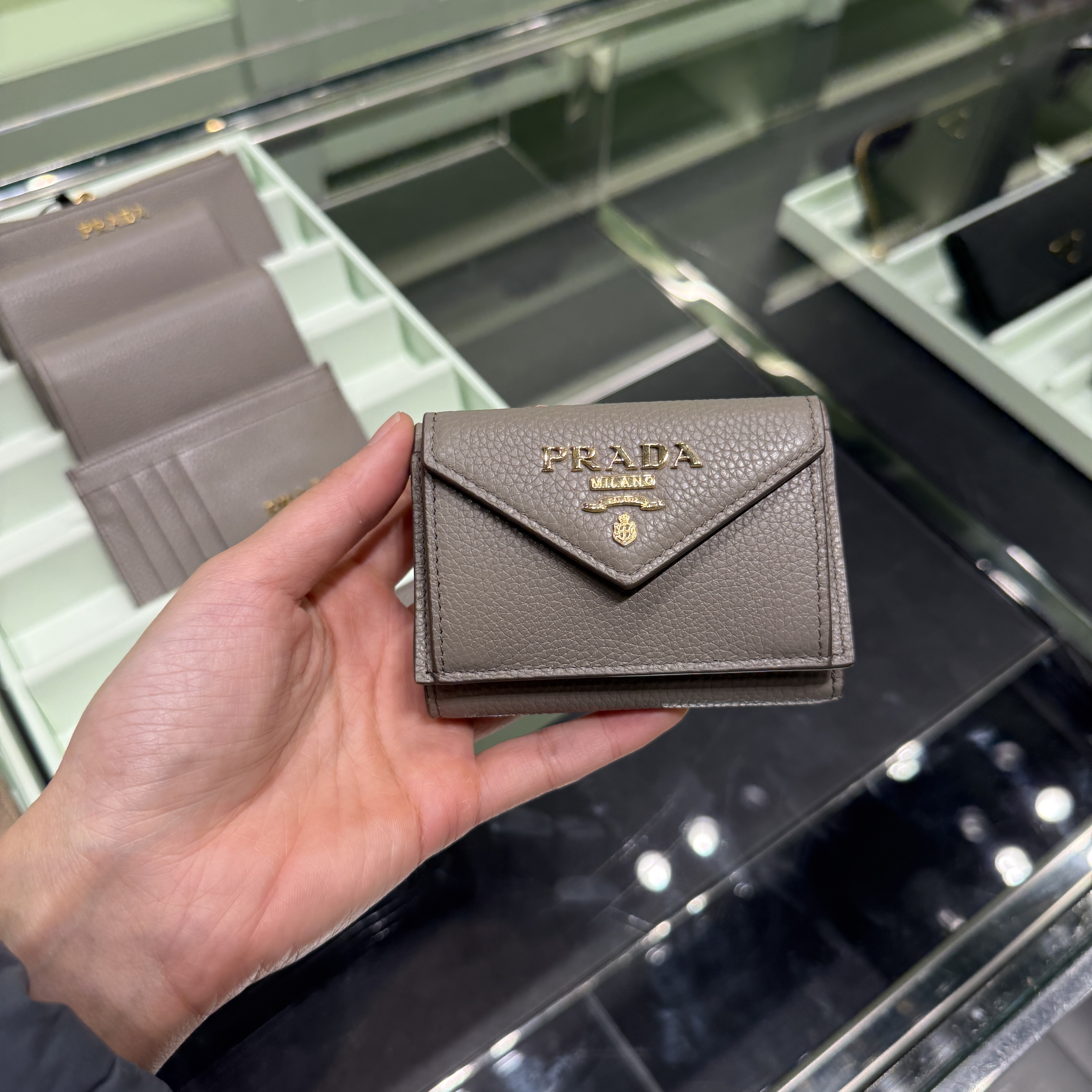 Prada grainy embossed tri-fold wallet grey 1MH021