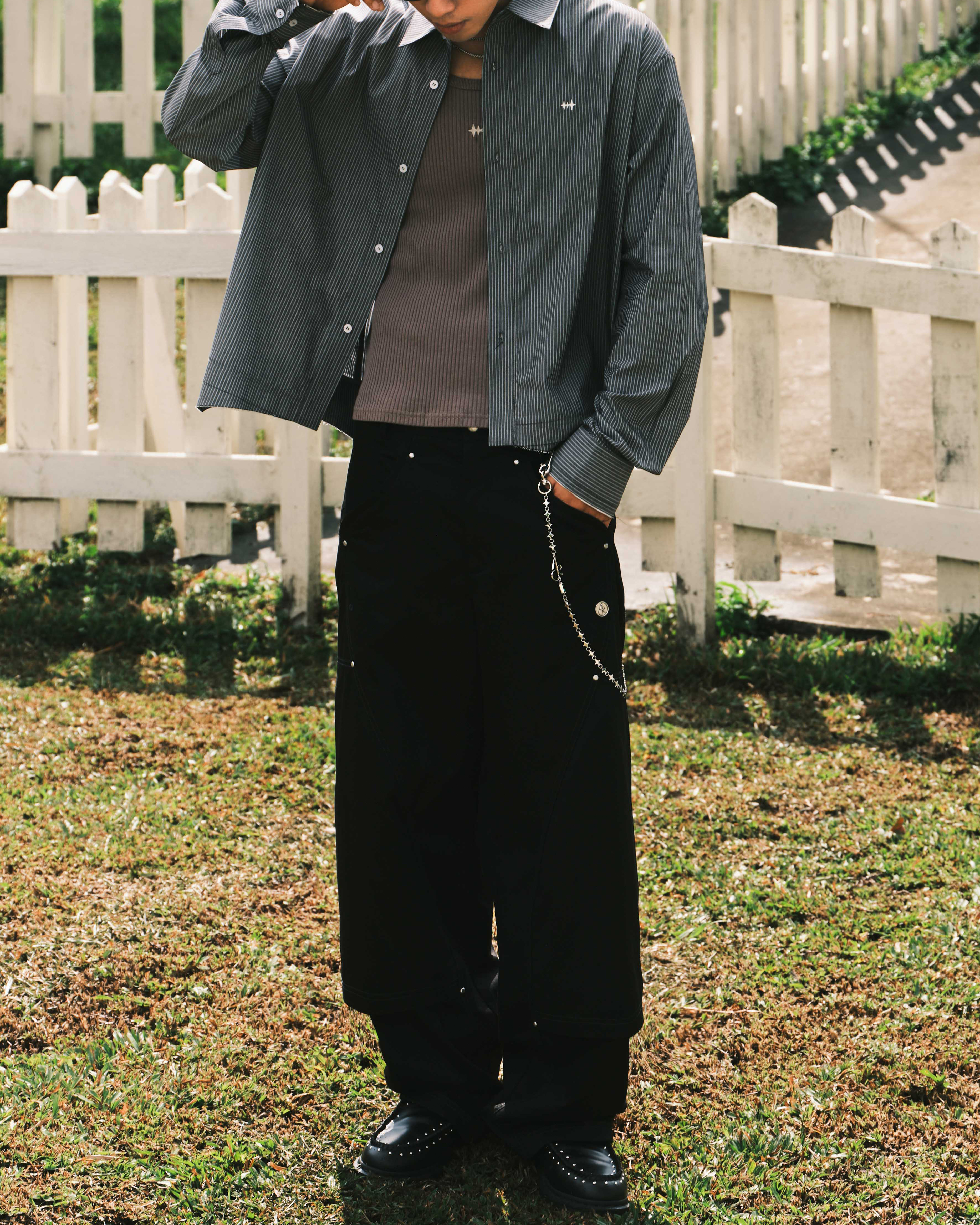 CURVED CUT PLEATED TROUSERS - BLACK