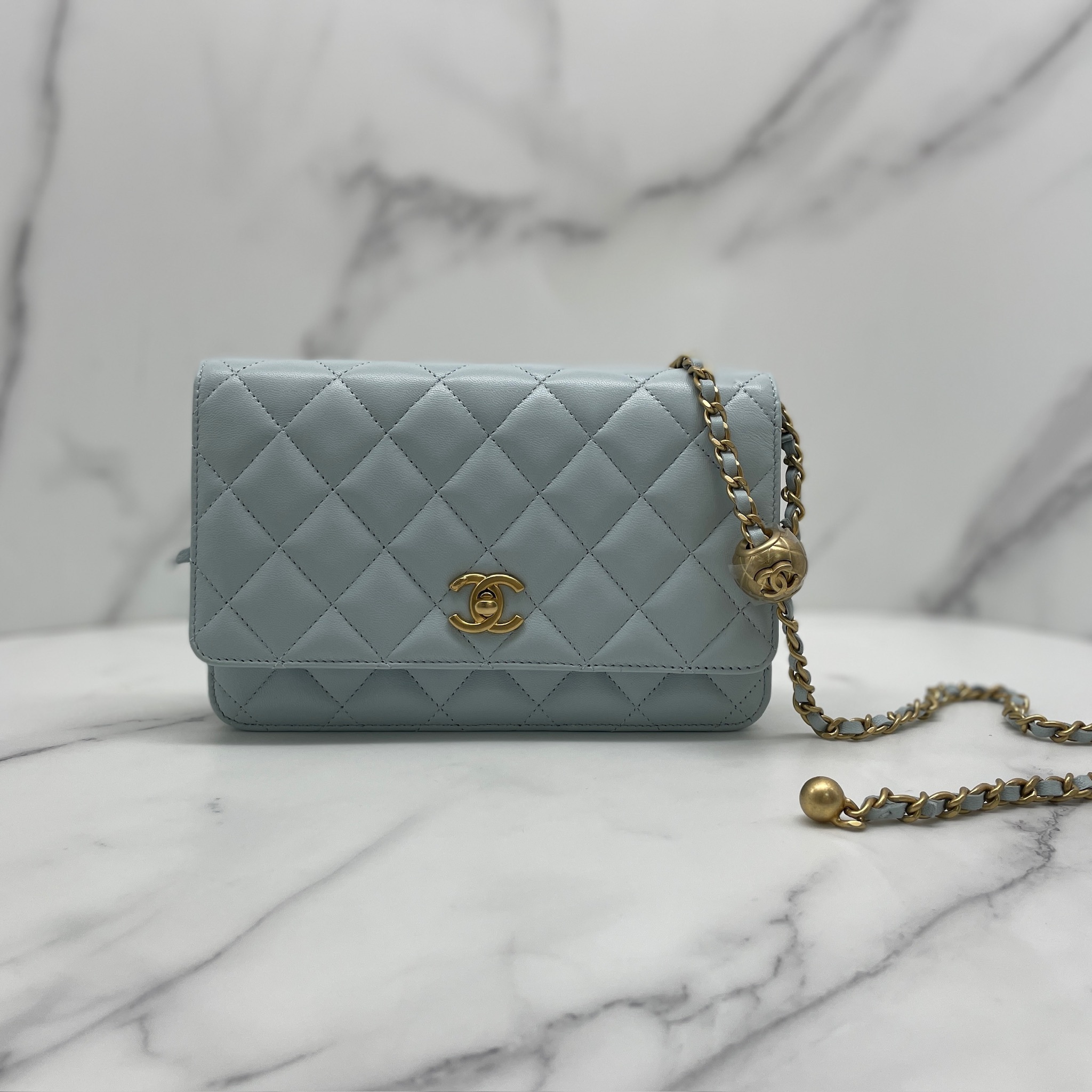 Chanel Woc with gold ball