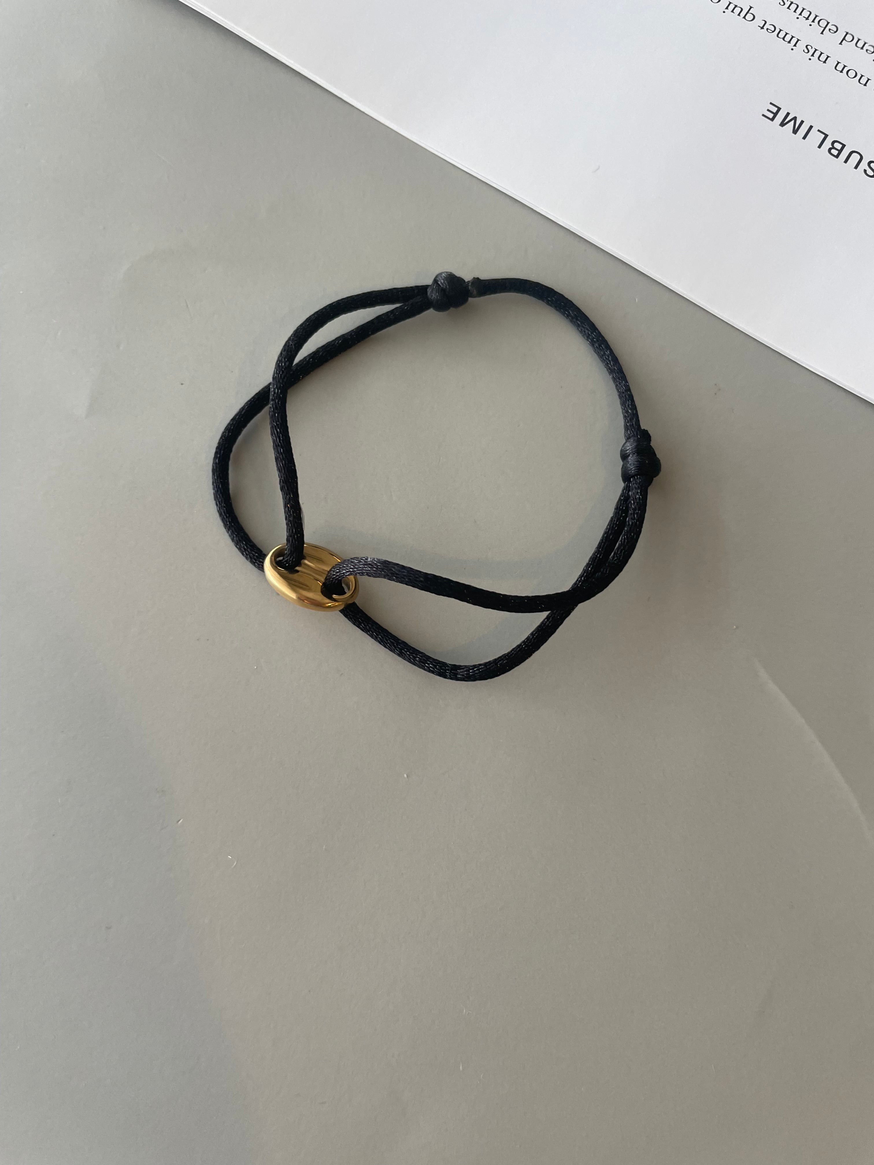 black cord bracelet