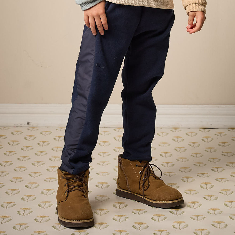 PIPPY 休閒剪接風衣布抽繩鬆緊長褲 藍