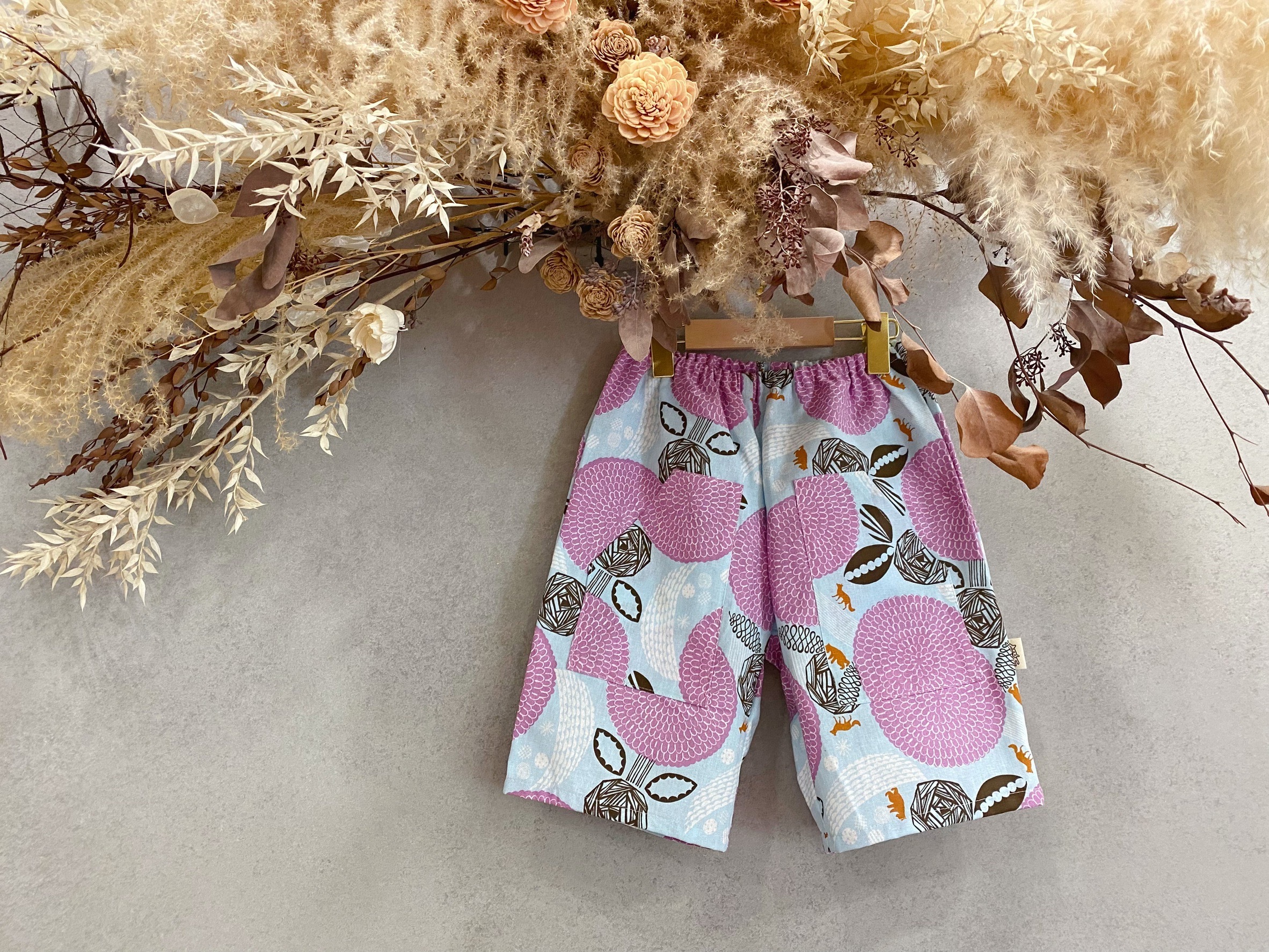 粉紅玫瑰狼 斜口袋短褲（130）