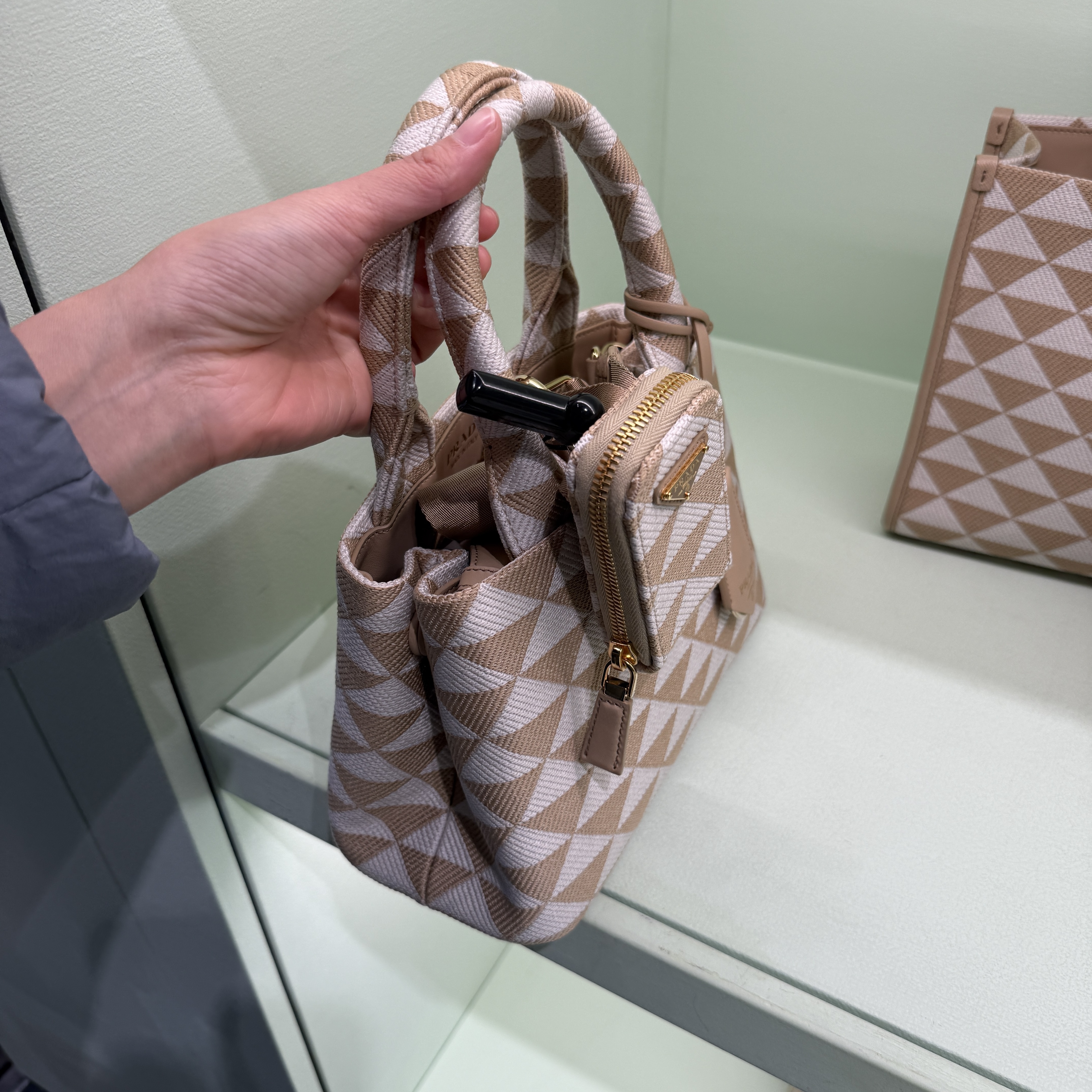 Prada Symbol Embroidered Mini top handle bag Beige 1BA354