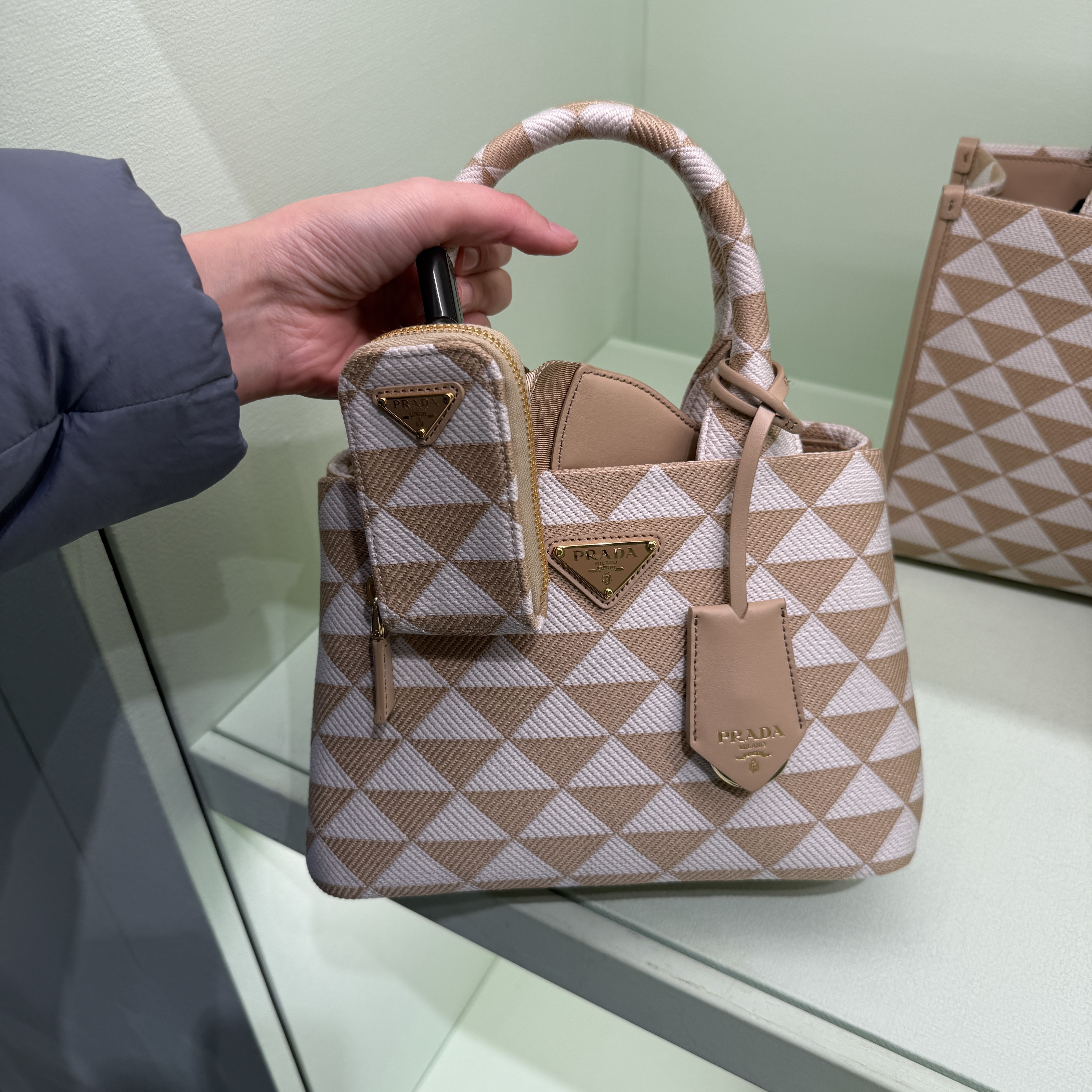 Prada Symbol Embroidered Mini top handle bag Beige 1BA354