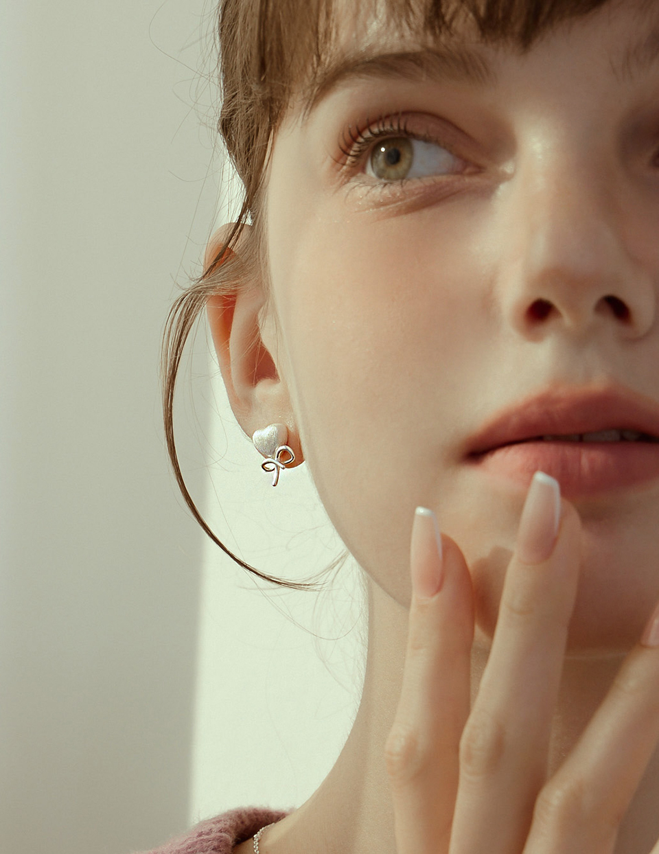 不對稱繩結愛心。針式耳環(銀)
