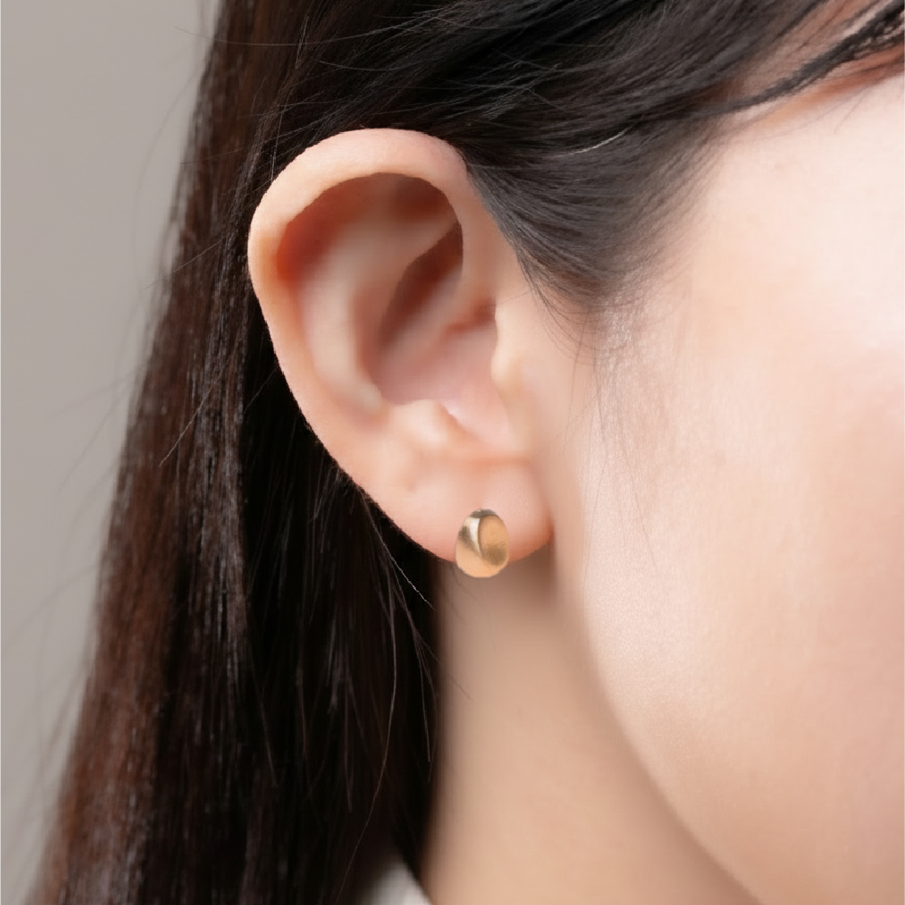 Bean-shaped gold and sterling silver earrings