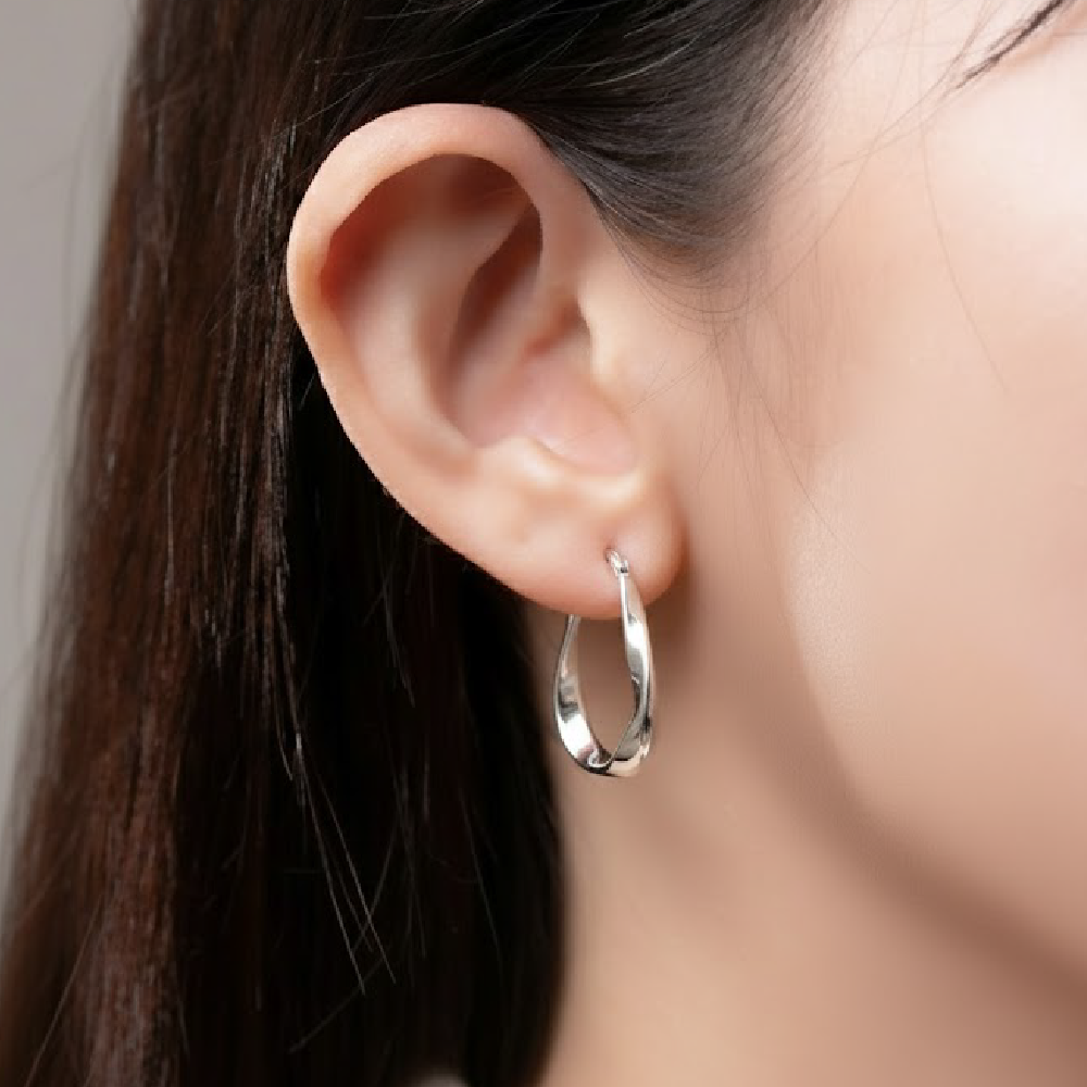 Arc-shaped zigzag hoop earrings in sterling silver