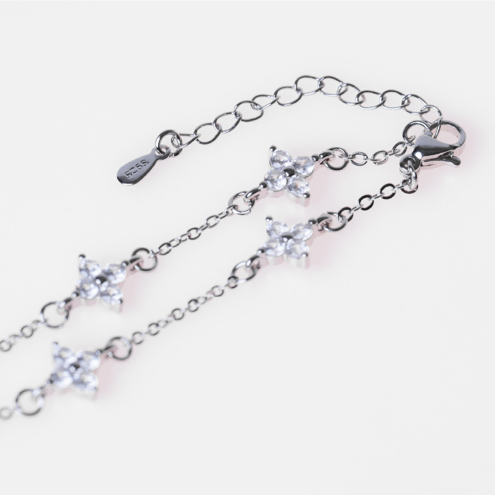 Four-leaf clover diamond-encrusted sterling silver bracelet