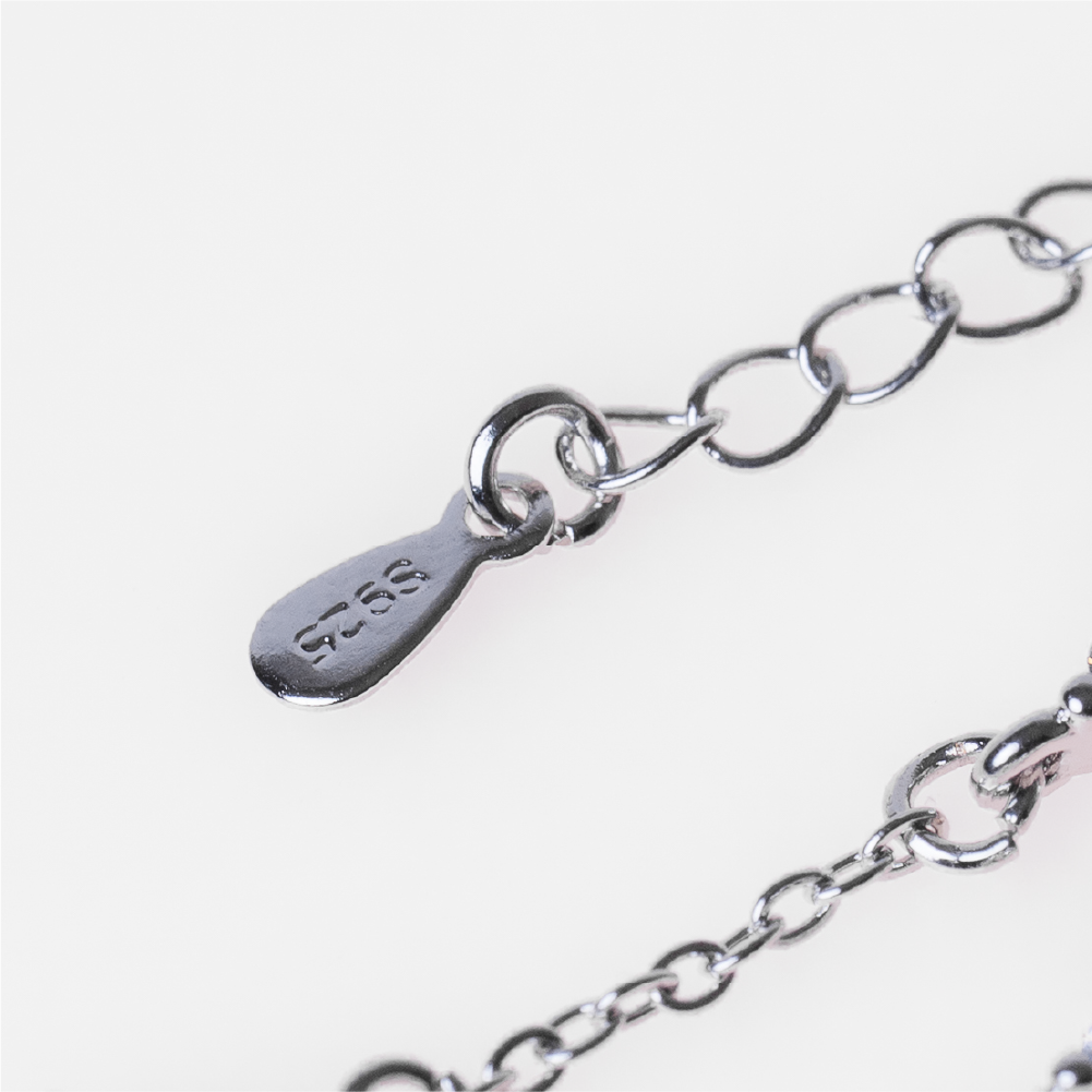 Four-leaf clover diamond-encrusted sterling silver bracelet