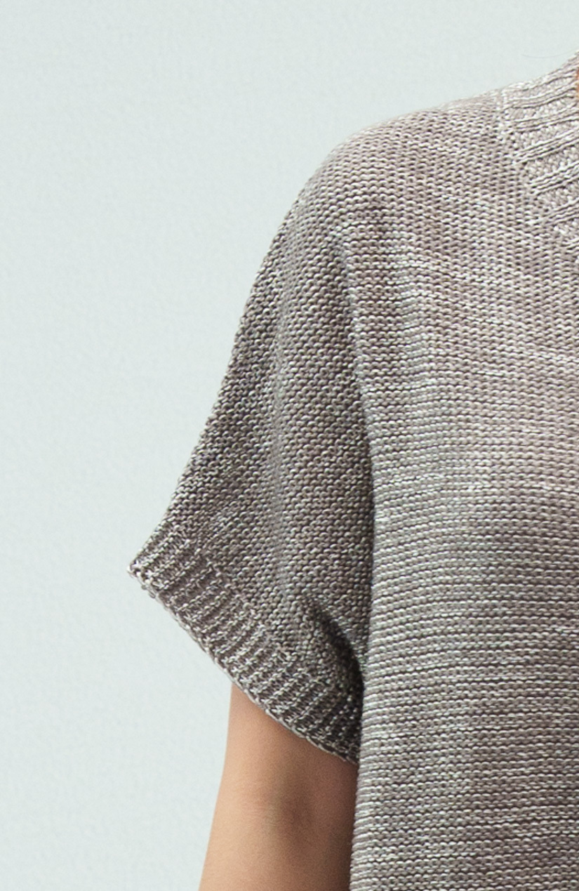 針織衫細節圖: 袖口運用手編感的翻針設計