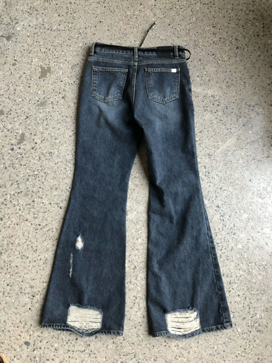 腳跟破損牛仔長褲