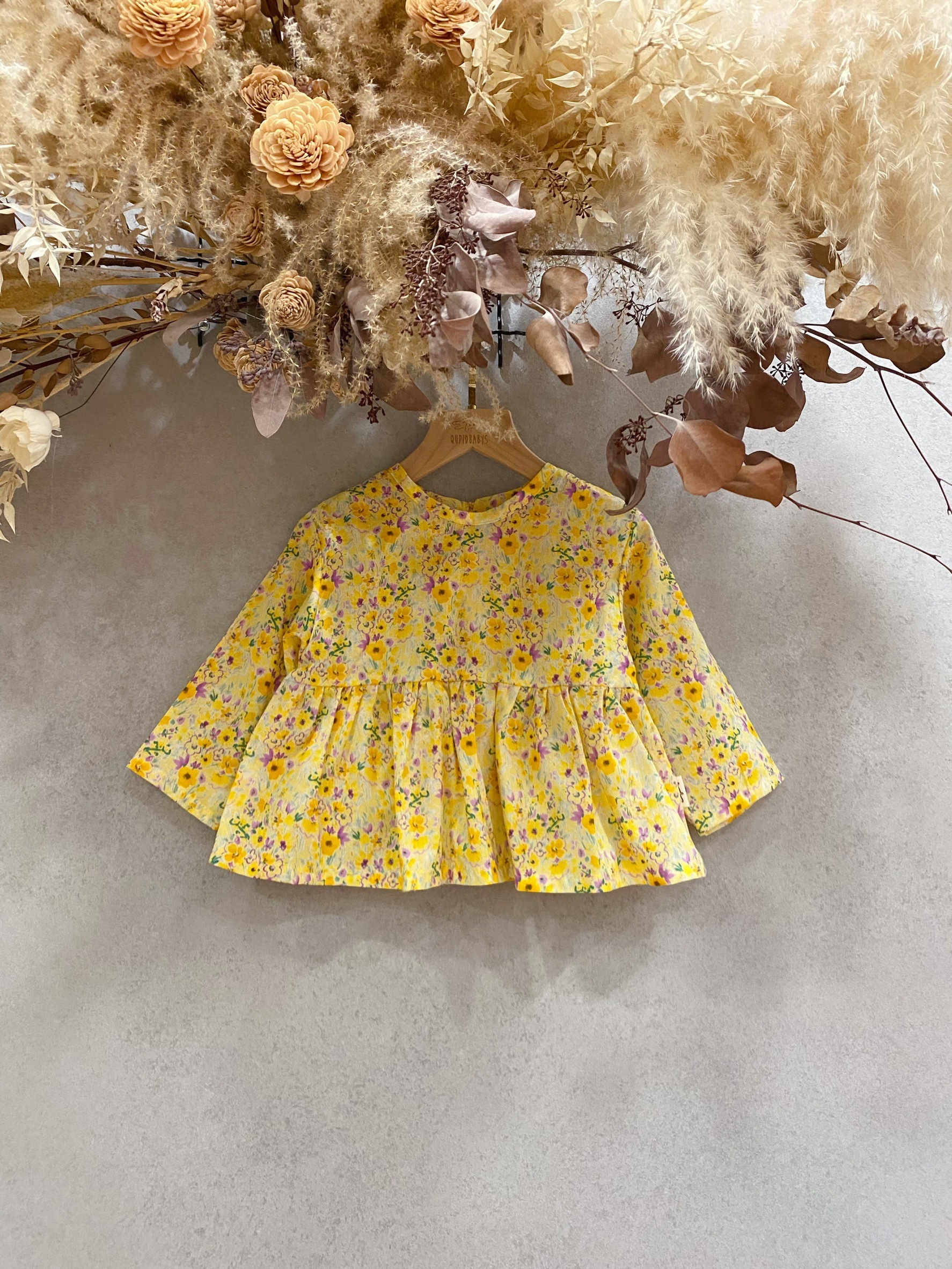 黃紫碎花 裙擺搖搖長袖上衣（80）