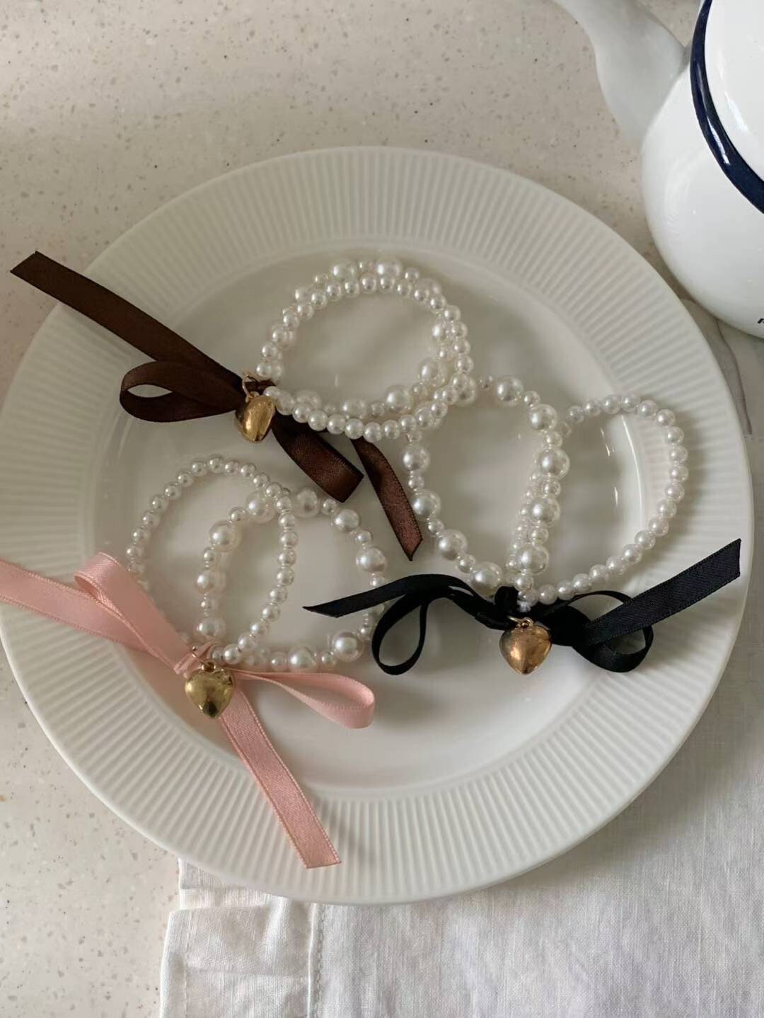 愛心綴飾蝴蝶結造型彈力珍珠髮帶 / 3色