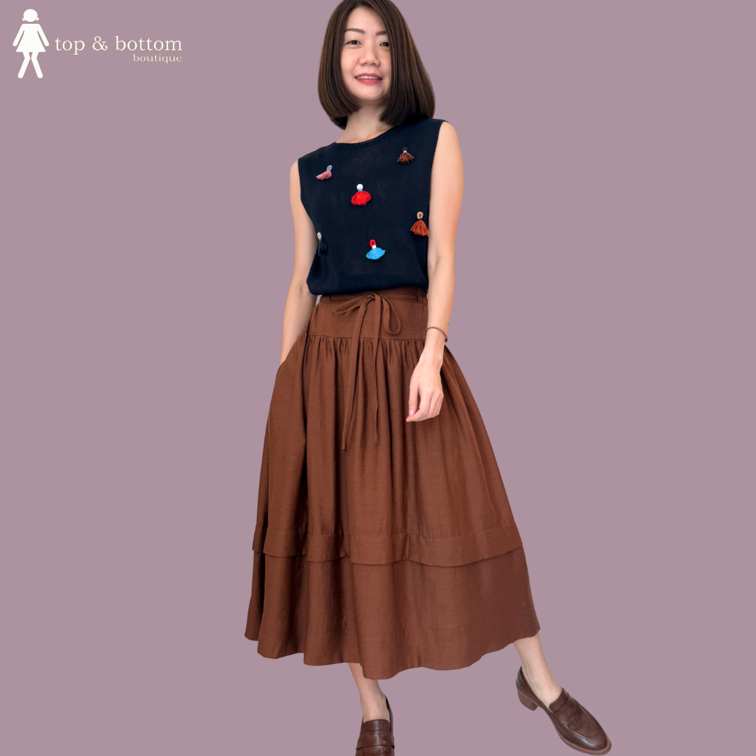 SLEEVELESS KNIT BLOUSE WITH TASSEL DETAILS