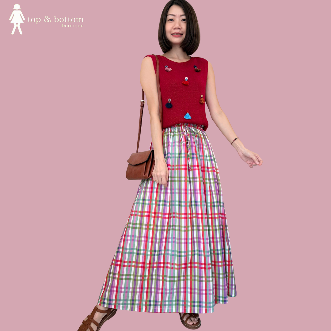 SLEEVELESS KNIT BLOUSE WITH TASSEL DETAILS