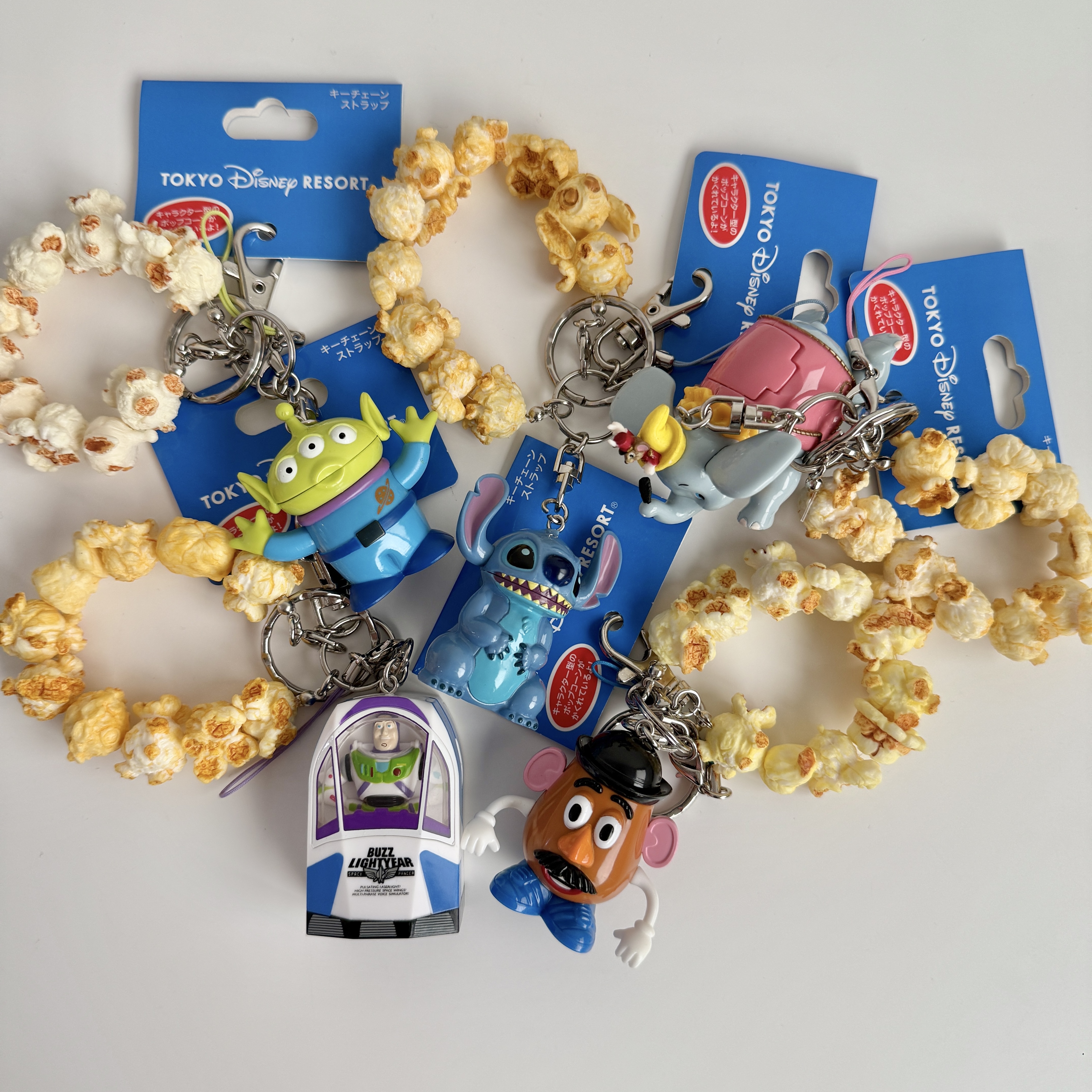 現貨┃Disney 東京迪士尼 三眼怪 巴斯 彈頭先生 小飛象 史迪奇 爆米花吊飾