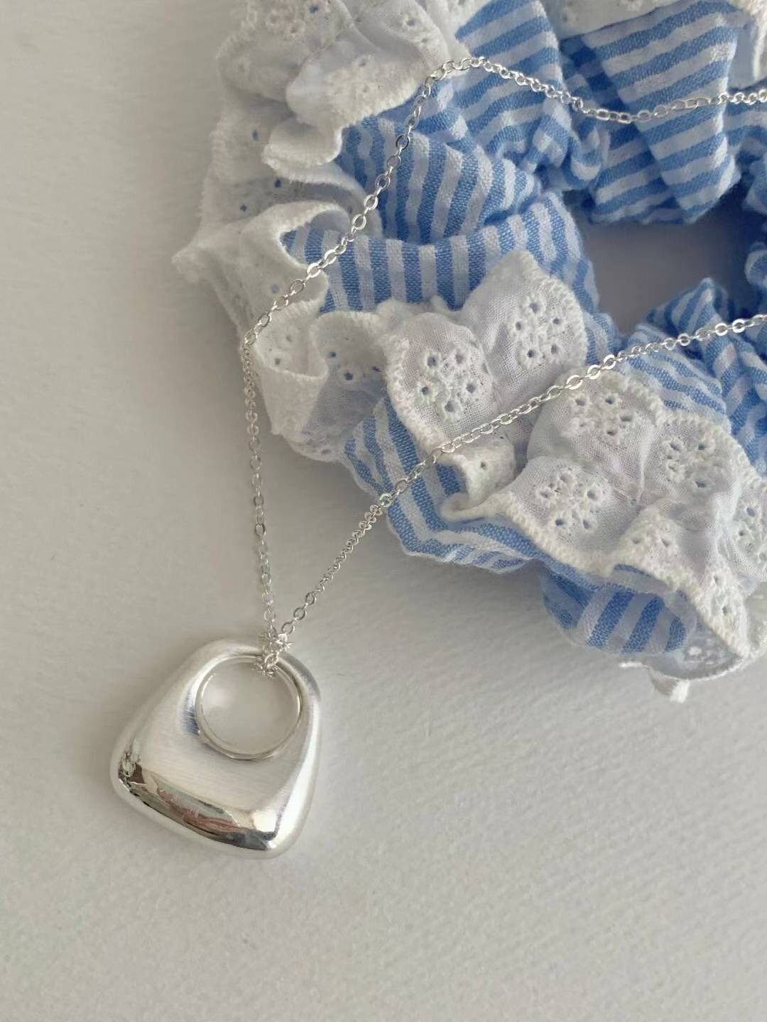 質感銀鏤空手提包包造型毛衣長項鍊