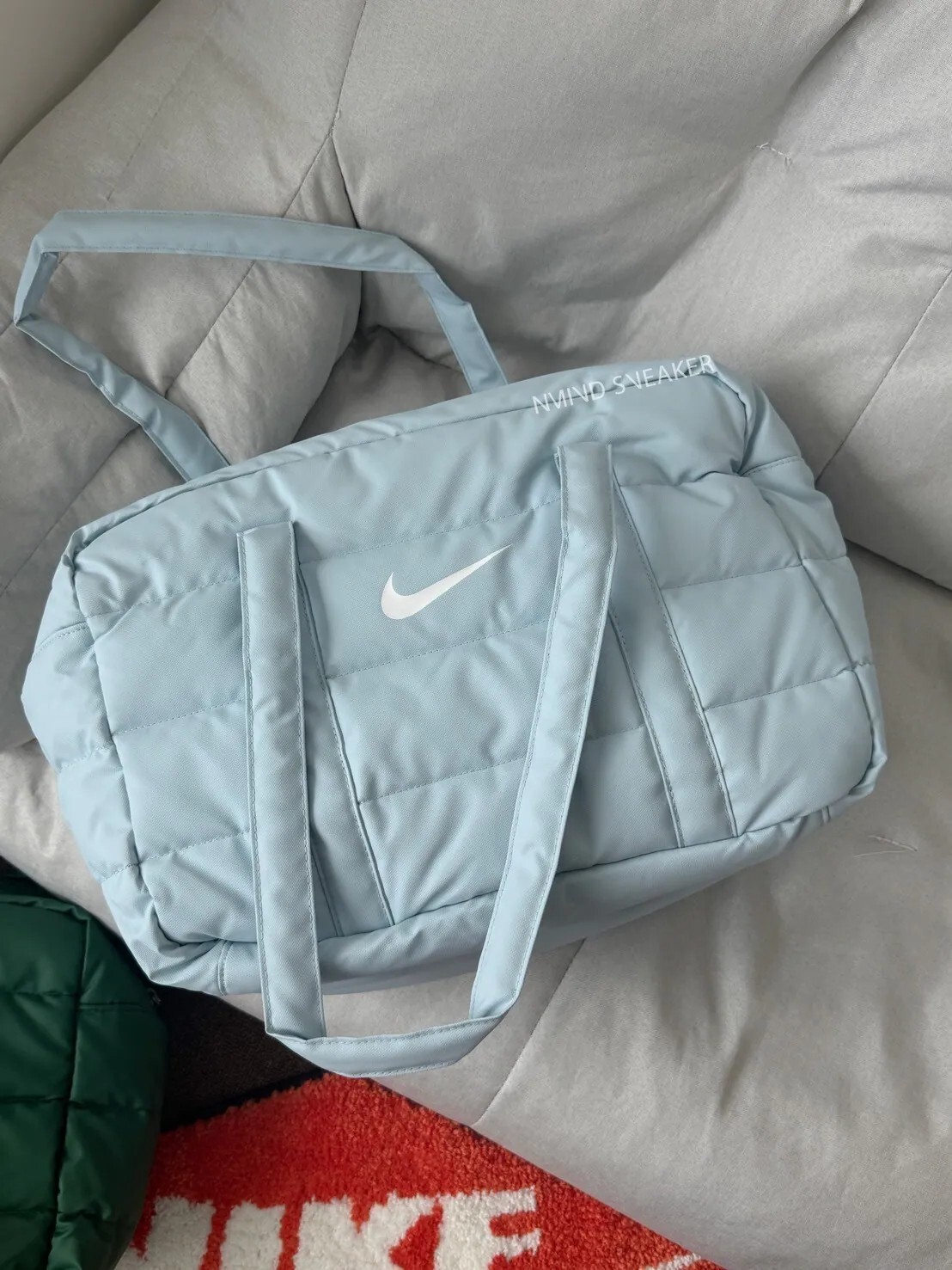 NG品-NIKE 空氣感枕頭羽絨包 防水 水藍色