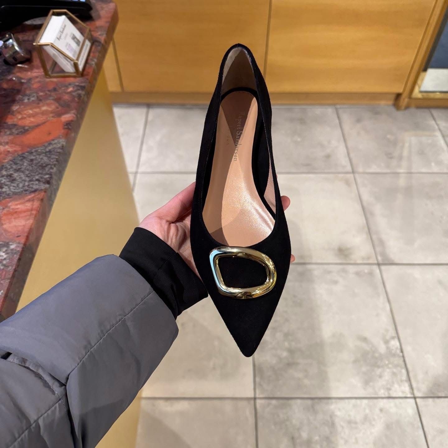 Rupert Sanderson gold ring suede flats black