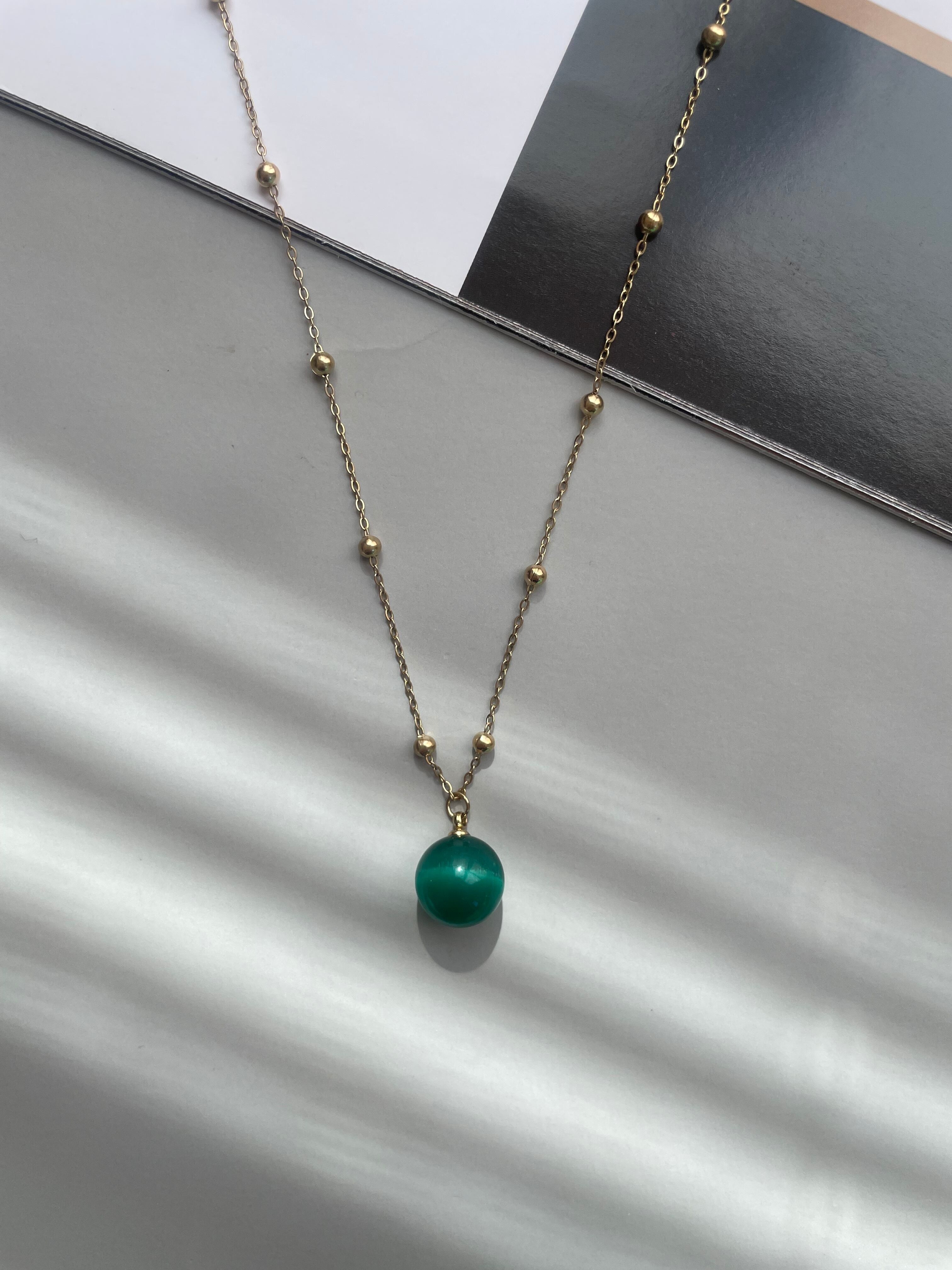 green ball necklace