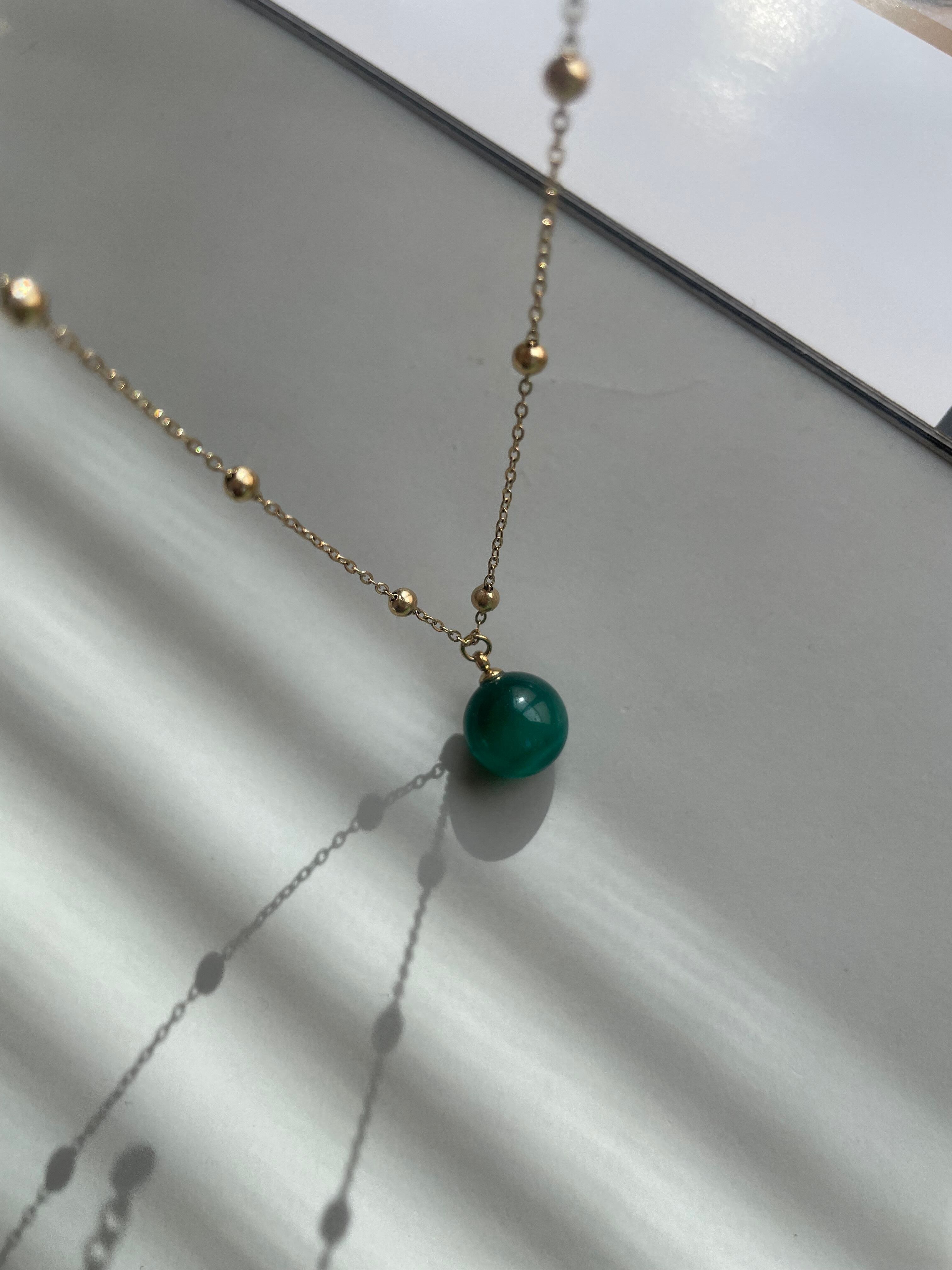 green ball necklace