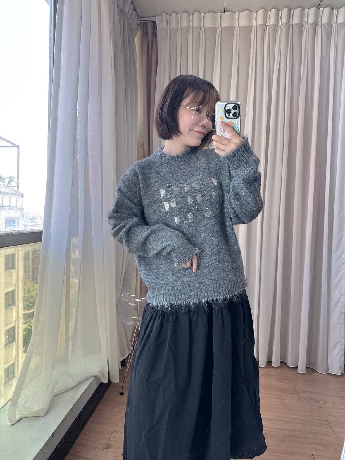 Distressed and stylish shiny letter sweater