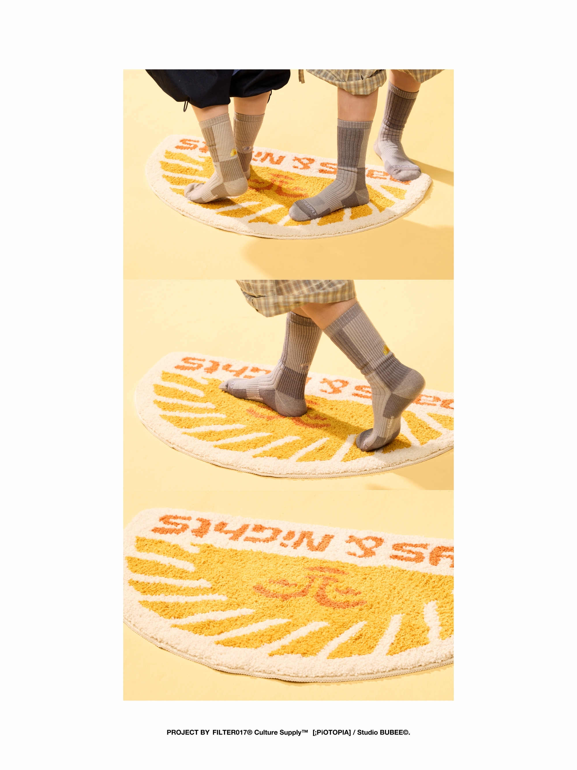 兩人穿著卡其及灰色刺繡羊毛襪站在橘黃色半圓形地墊上，背景為明亮黃色，呈現襪子與地墊的設計細節。
