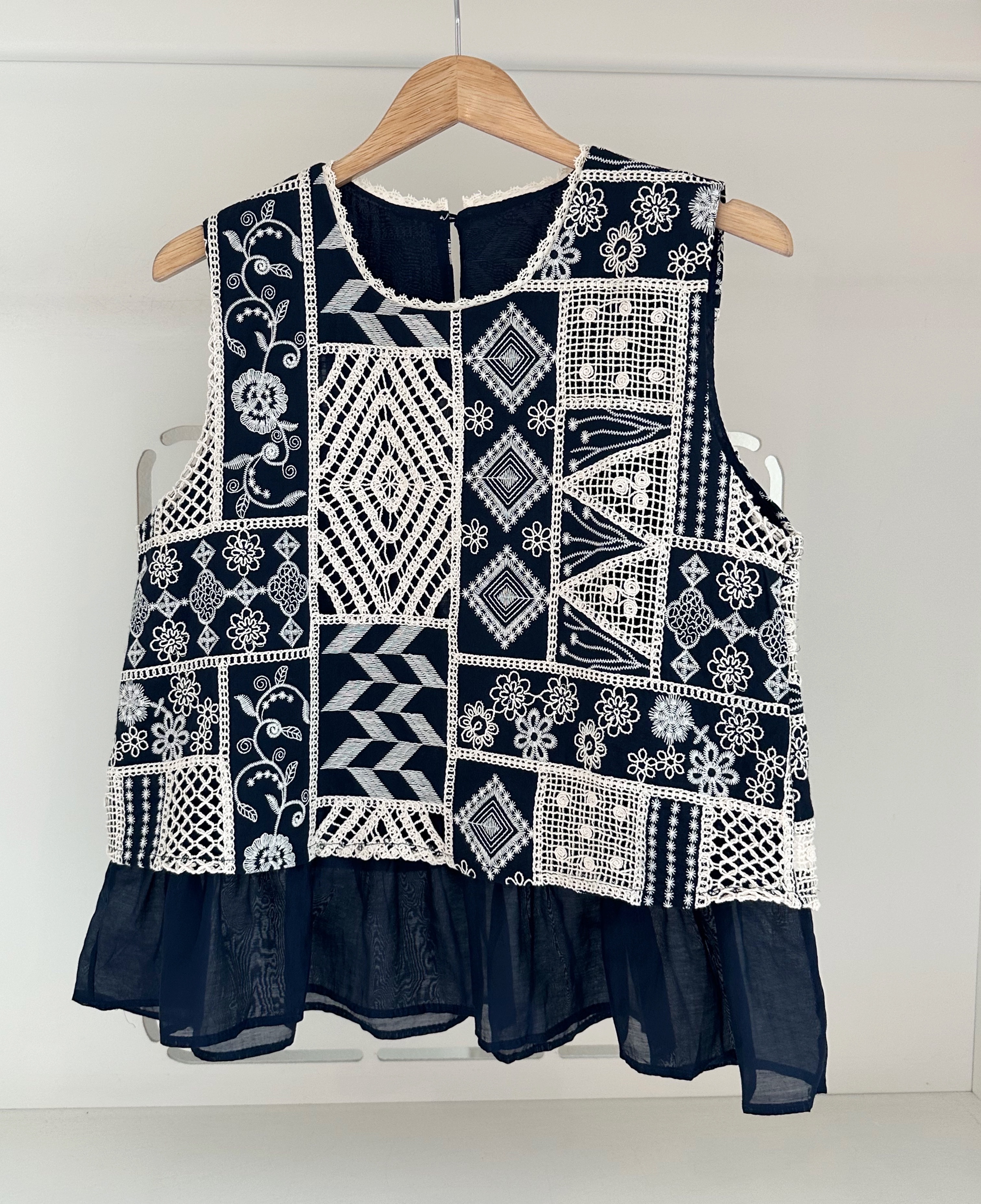 SLEEVELESS EMBROIDERED MOTIF BLOUSE