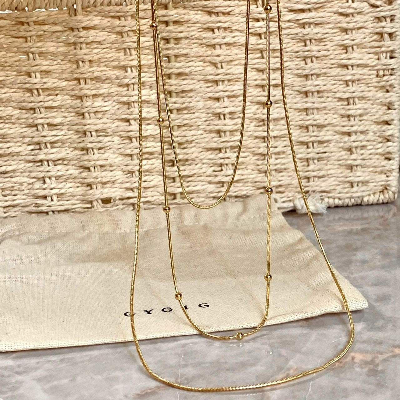 Gy”蛇骨圓珠一體式三層垂墜細毛衣鏈