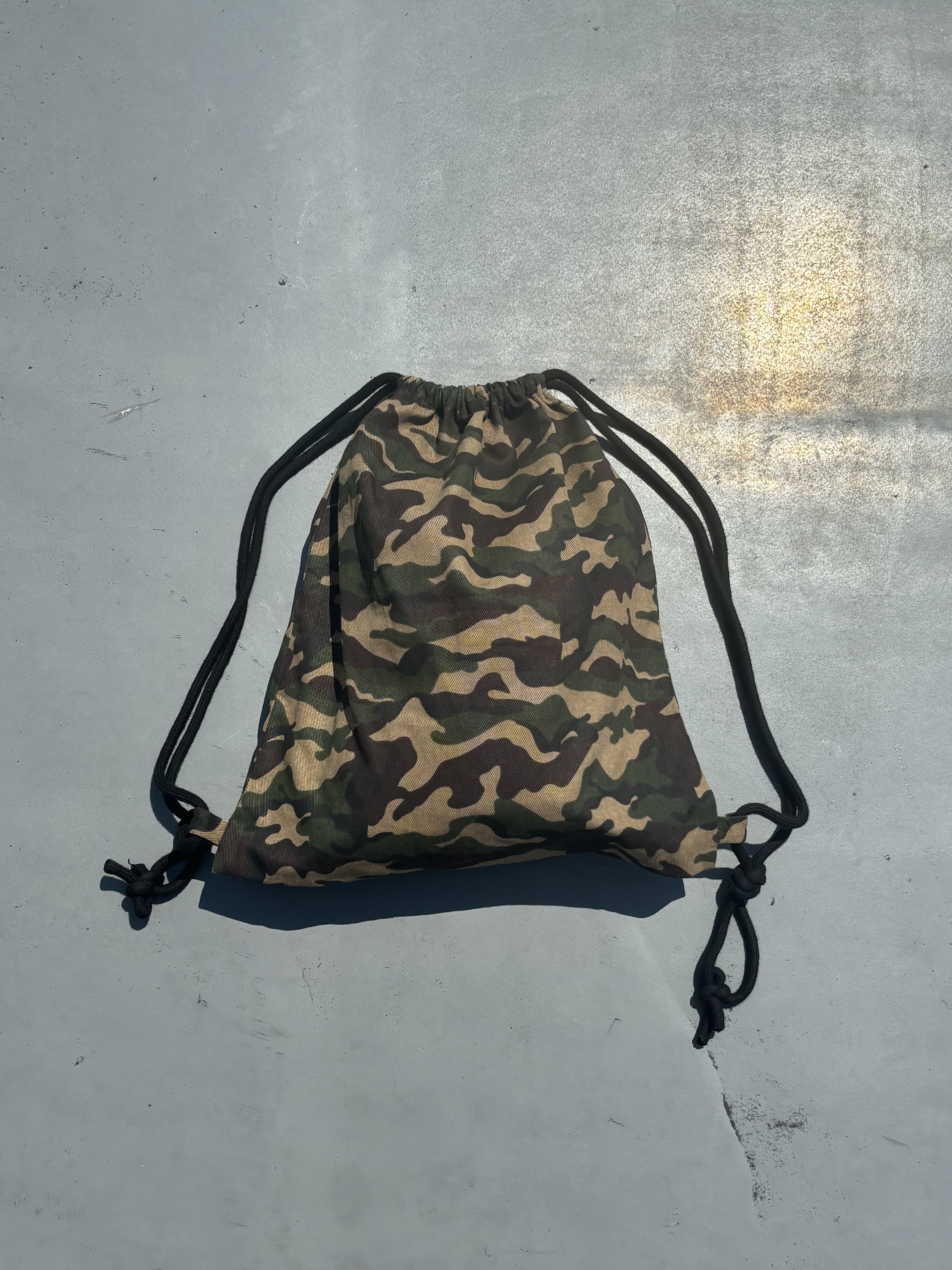 Beck × 9090 Camo Knapsack
