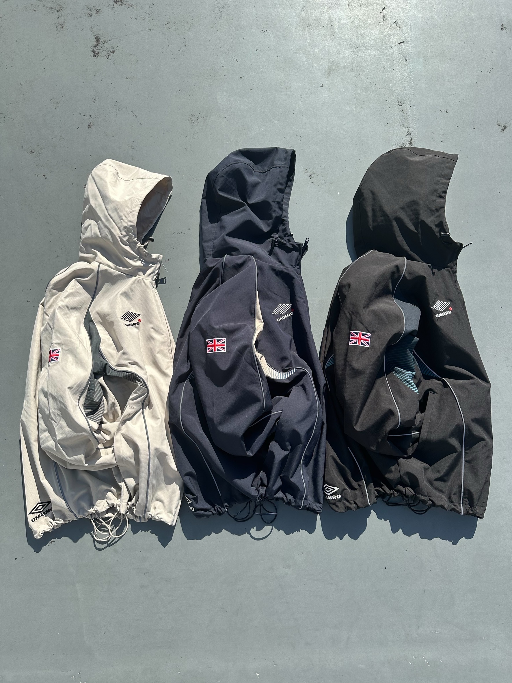9090 × umbro Gradation Nylon Hooded Jacket