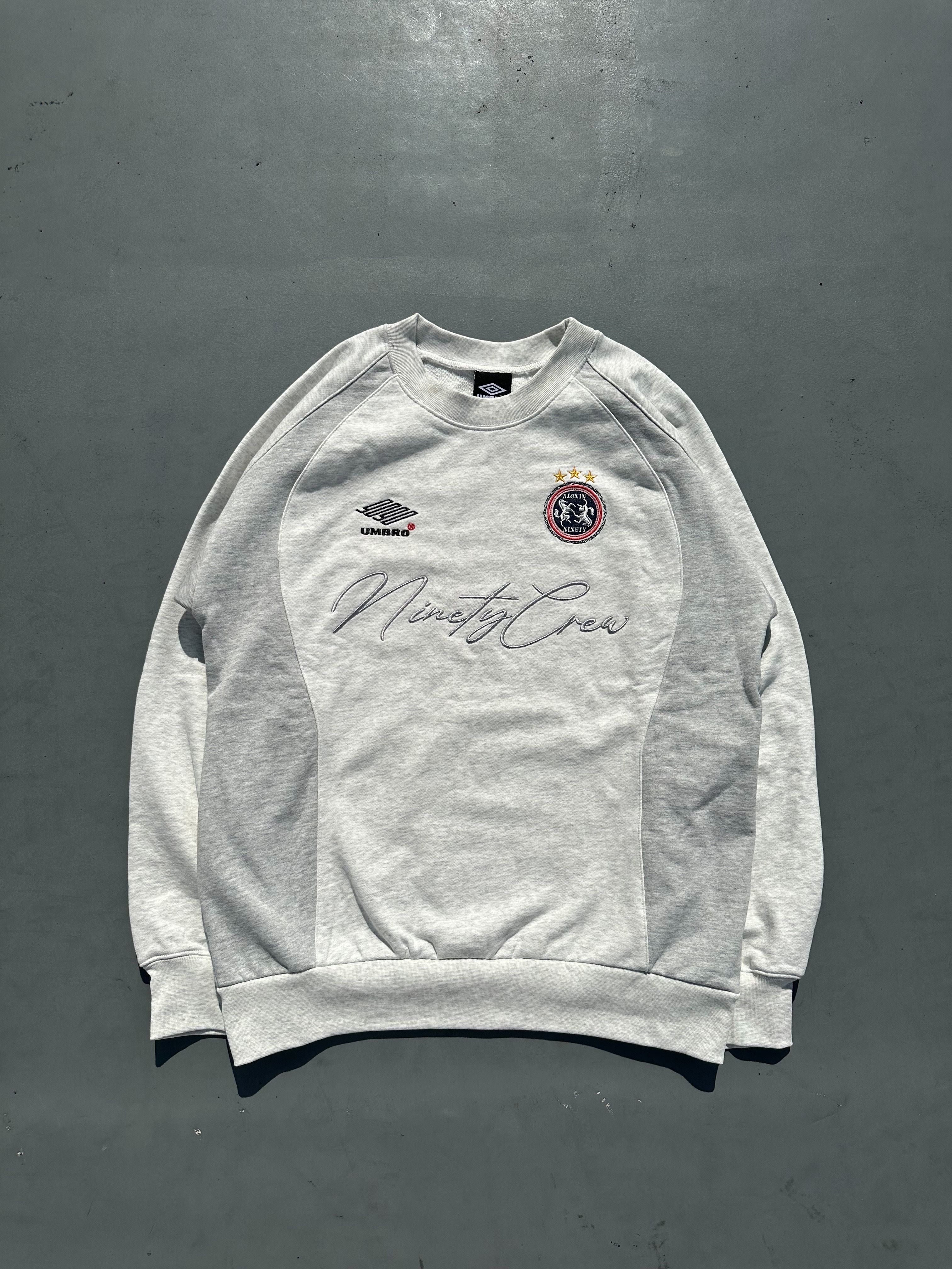 9090 × umbro Emblem Crewneck Sweat
