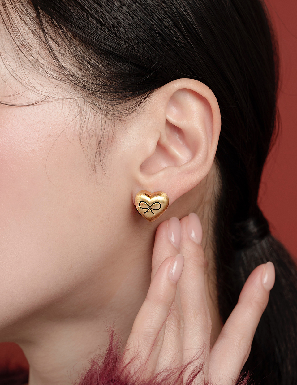 霧金蝴蝶結愛心。夾式耳環