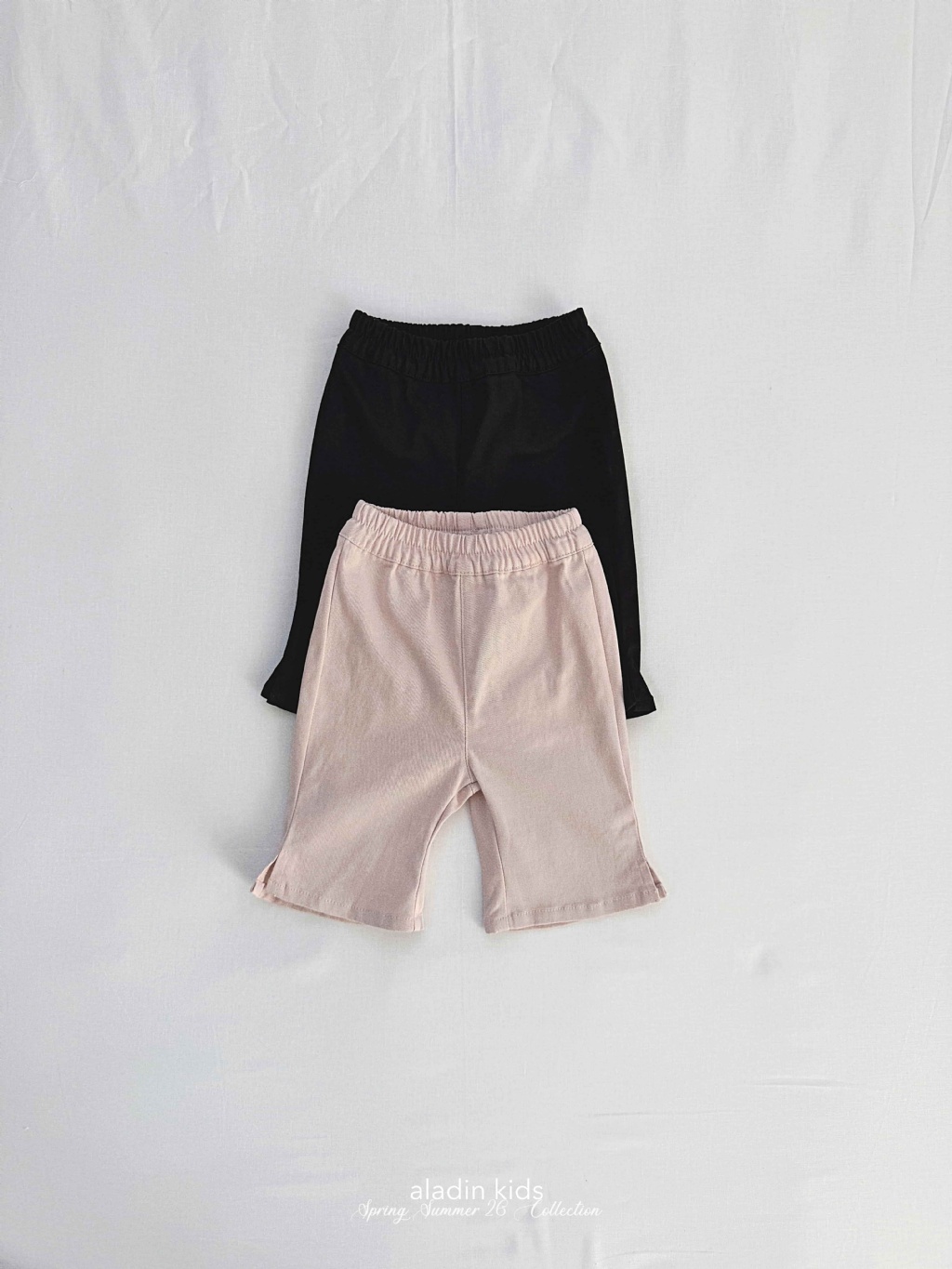 正韓春Aladin 兩色開衩七分喇叭褲