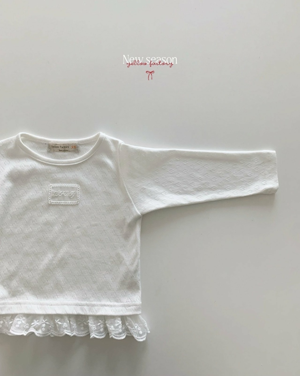 正韓春yellowfactory 愛心壓紋蕾絲拼接上衣